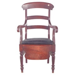 Silla orinal tapizada en negro del siglo XIX