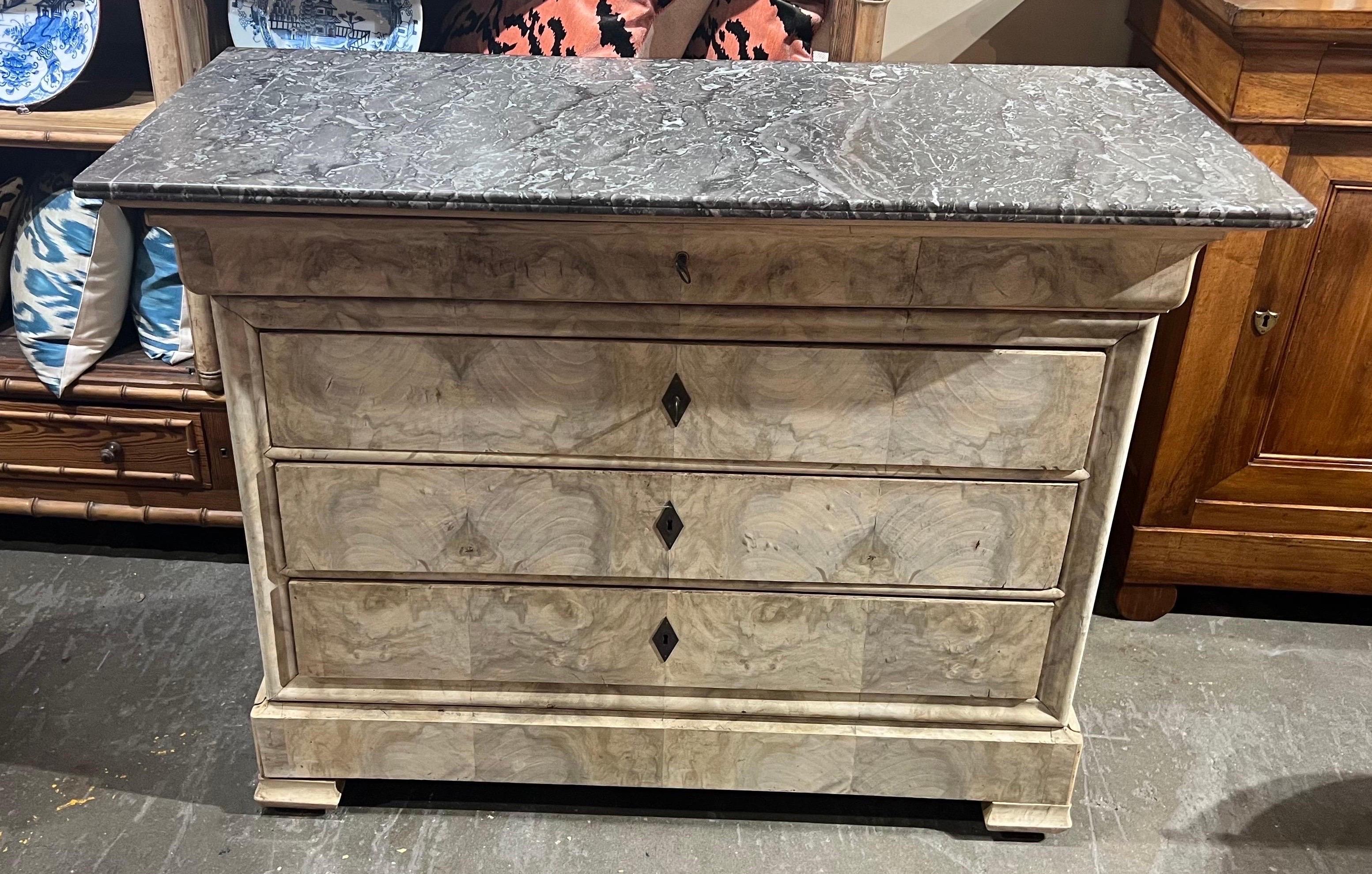 19th century bleached french fossilized marble top chest with hidden bottom drawer and diamond Escutcheons.