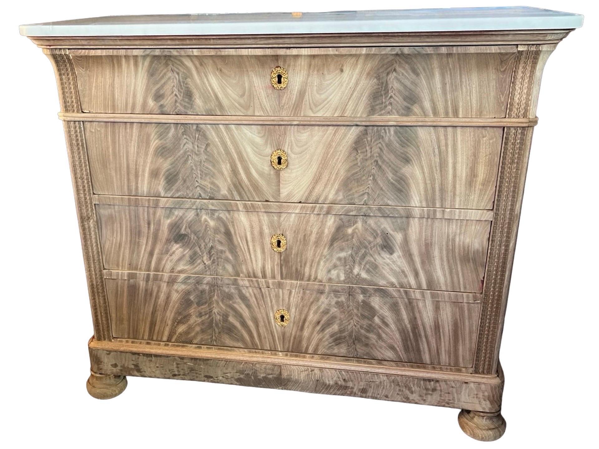 Carlo X secretary chest of drawers hand-made in Italy in the early 1800s using oak as secondary and book-matched mahogany veneer as primary woods. The chest features three functional drawers topped by a secretary flip down writing surface. Smaller