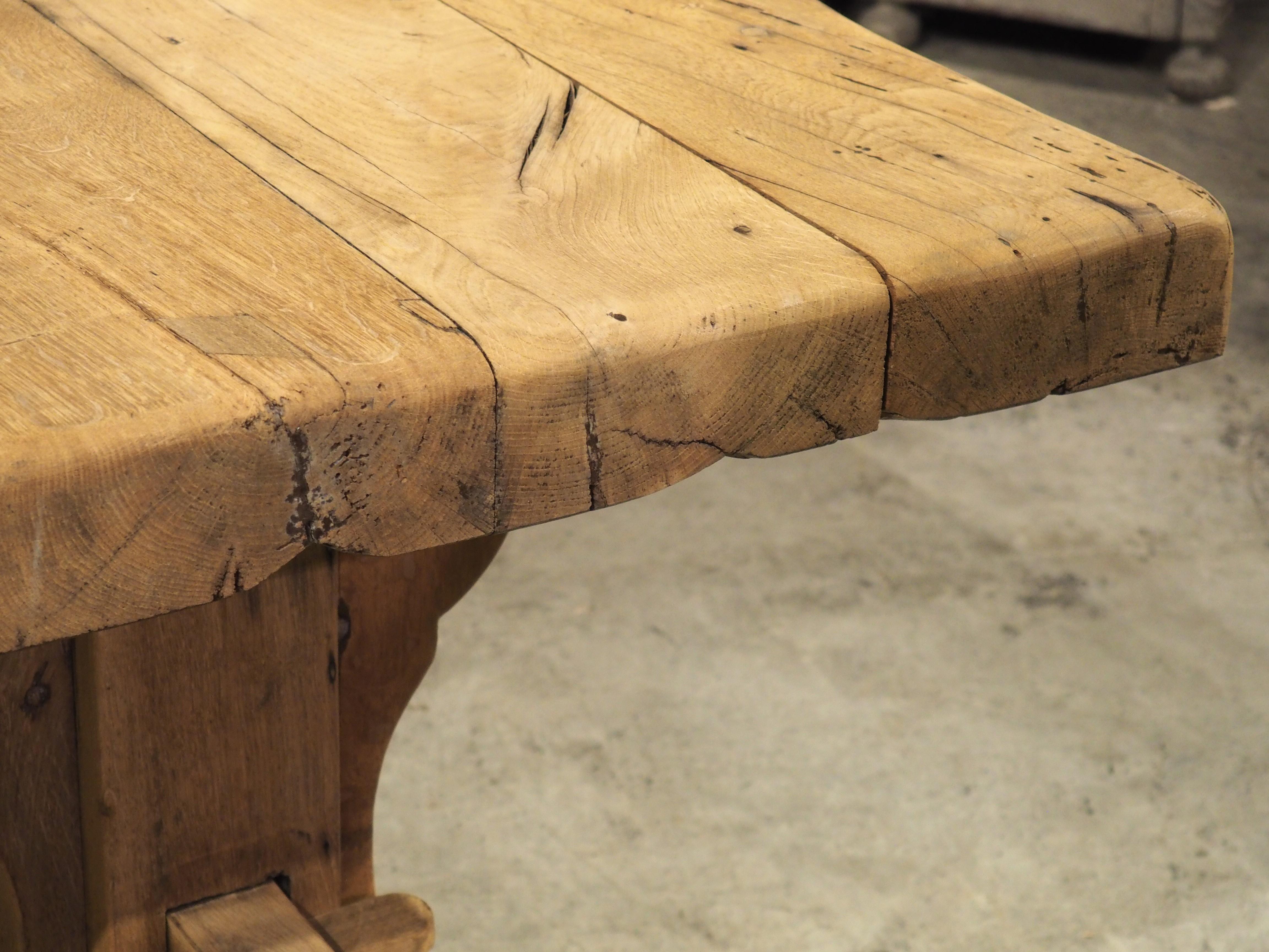 During the Middle Ages, robust dining tables, such as this bleached oak version, could be found in monasteries across Europe. Hand-carved in France during the 1800s, our monastery table has been bleached more recently, revealing deep graining and
