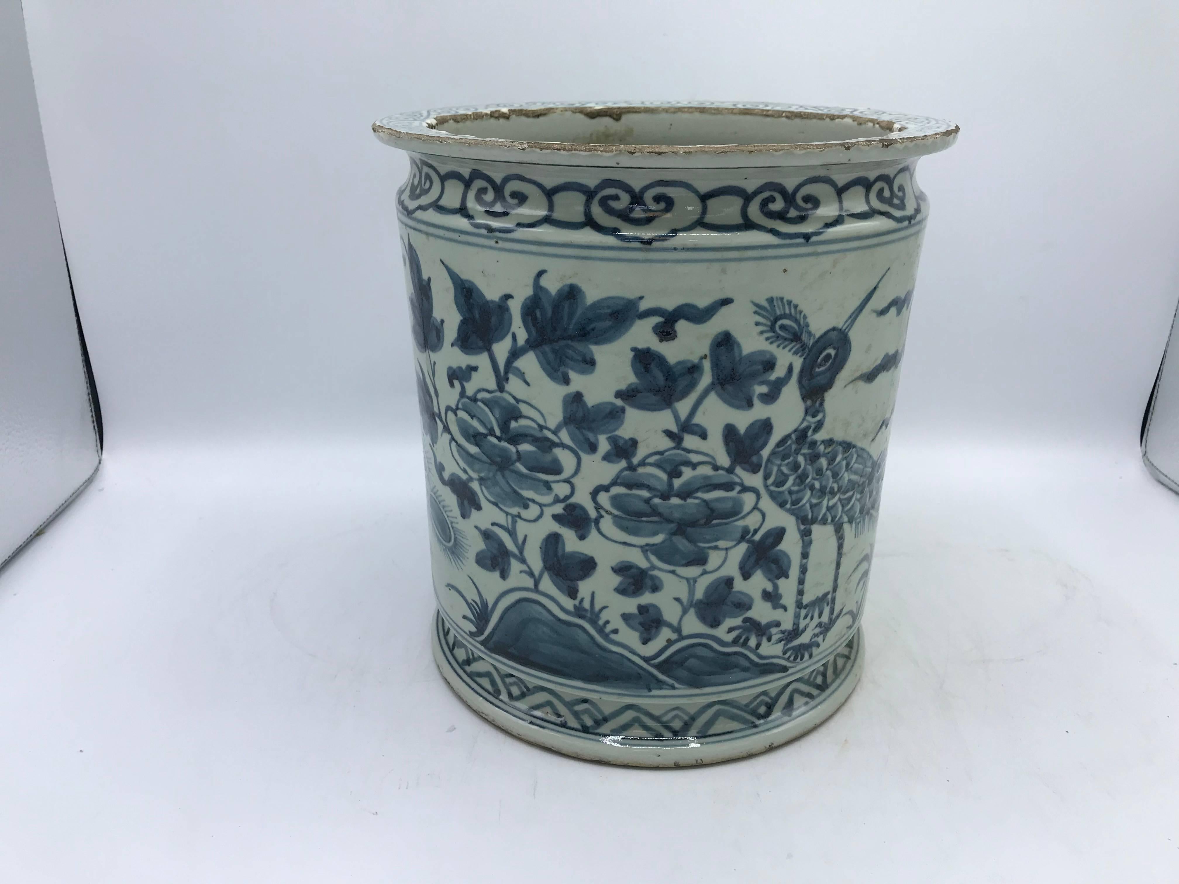 Listed is a gorgeous, 19th century blue and white cachepot planter. The piece has a stunning peacock and floral motif all-over. Heavy. Can hold water for its intended use.
