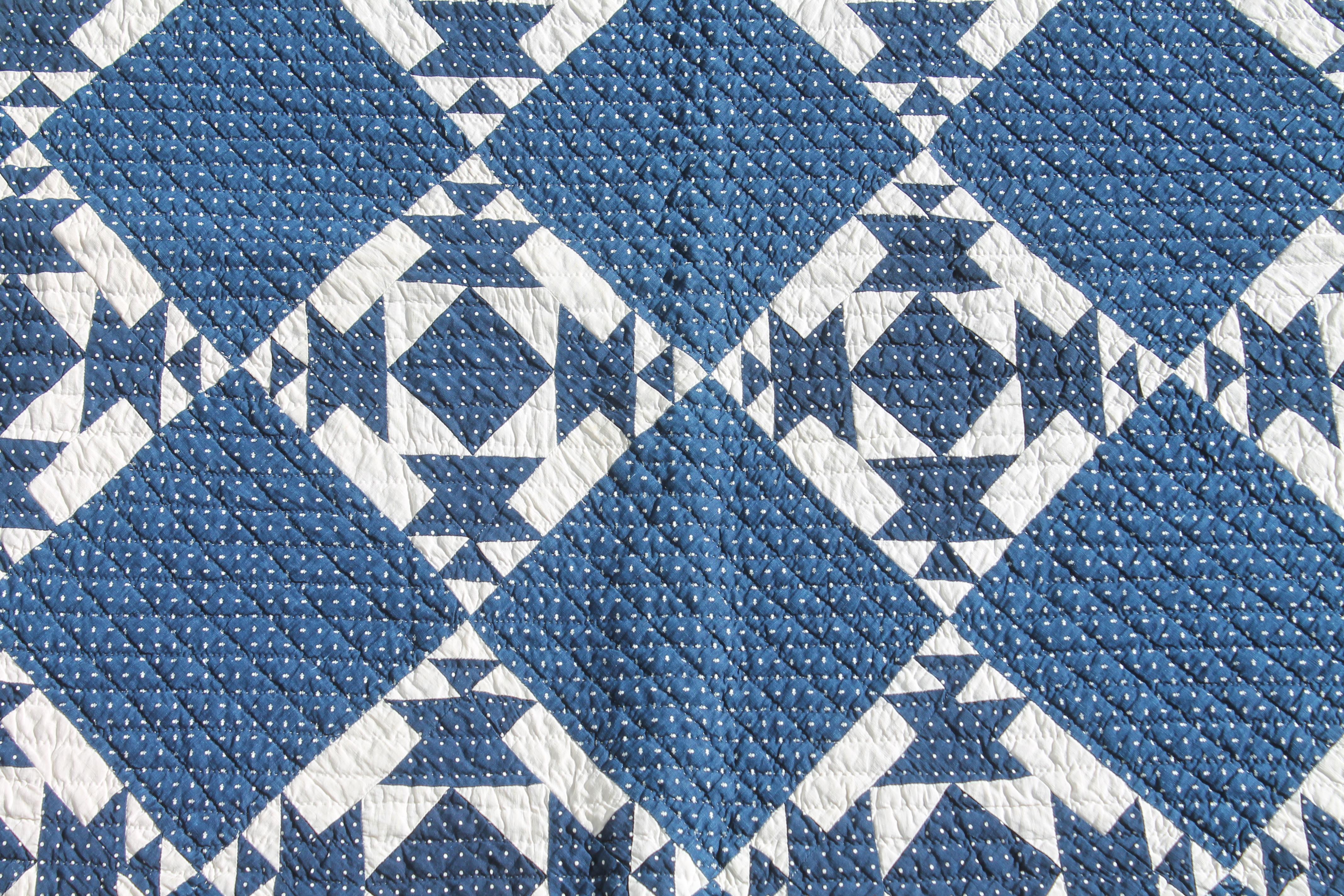 This fine dark blue and white geometric pattern quilt is in pristine condition. It was originally found in West Virginia and was made for Mt. Olive Baptist Church and has 