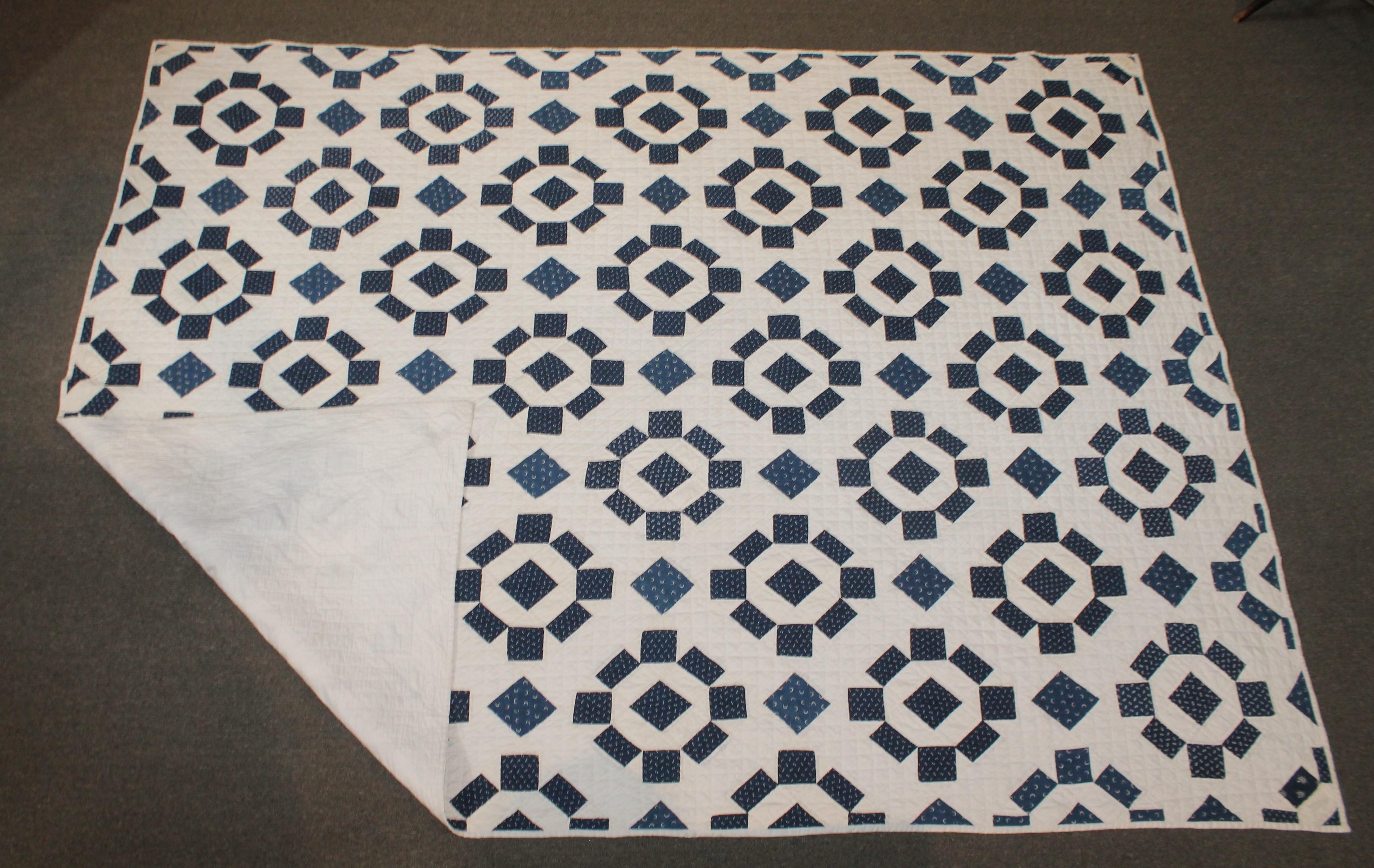 19th century blue and white geometric quilt with very nice quilting and piece work. The condition is very good condition.