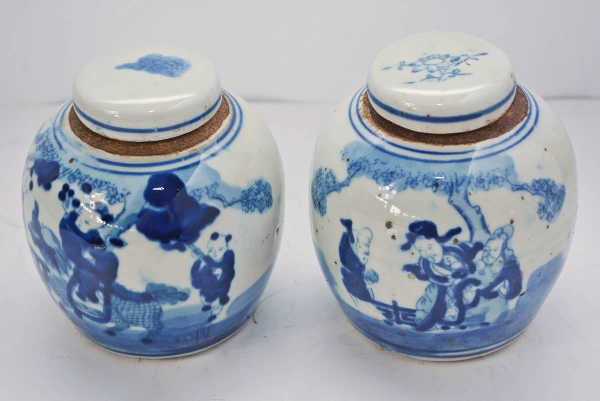 Pair of small 19th century blue and white ginger jars. The pair has a beautiful, all-over figure decoration.  The pair is small but full of charm.