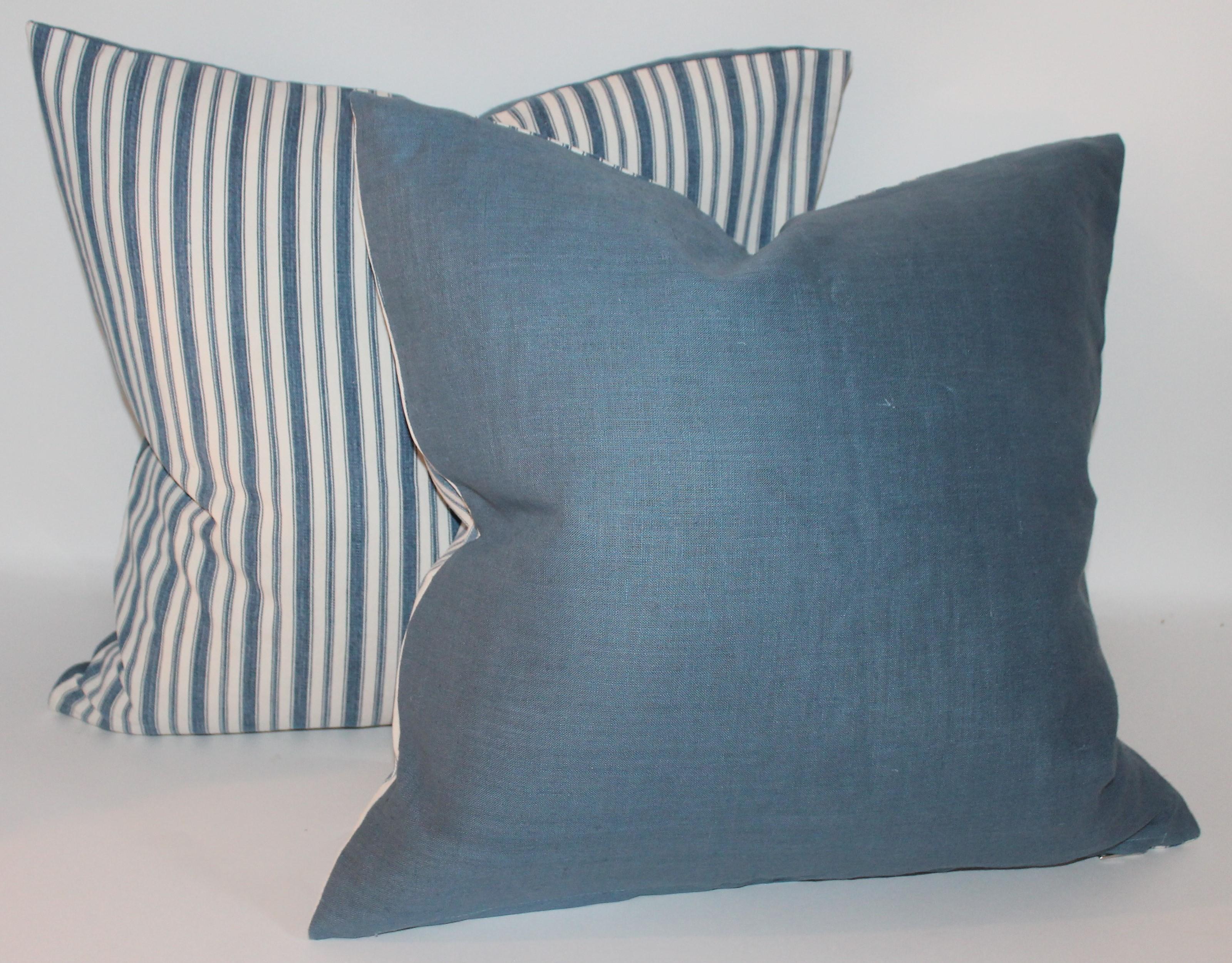 These 19th century blue and white ticking pillows are in good condition. Sold in pairs. Two pairs in stock.