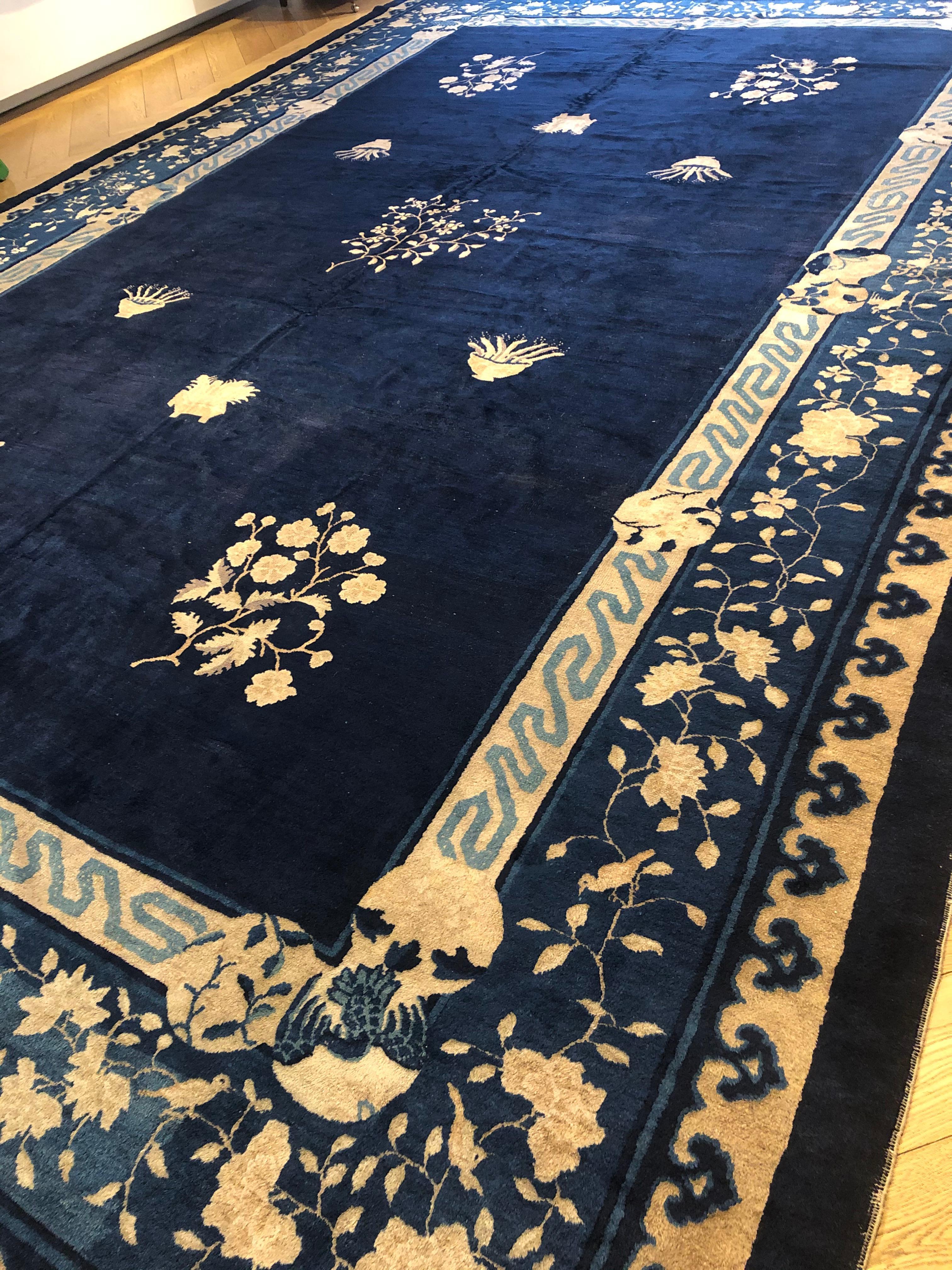 The Chinese garden in a carpet: the decorative layout of this 19th century carpet expresses the harmony given by the shapes of the plants and flowers in their pots. The Chinese garden brings together elements of a fauna character with architectural