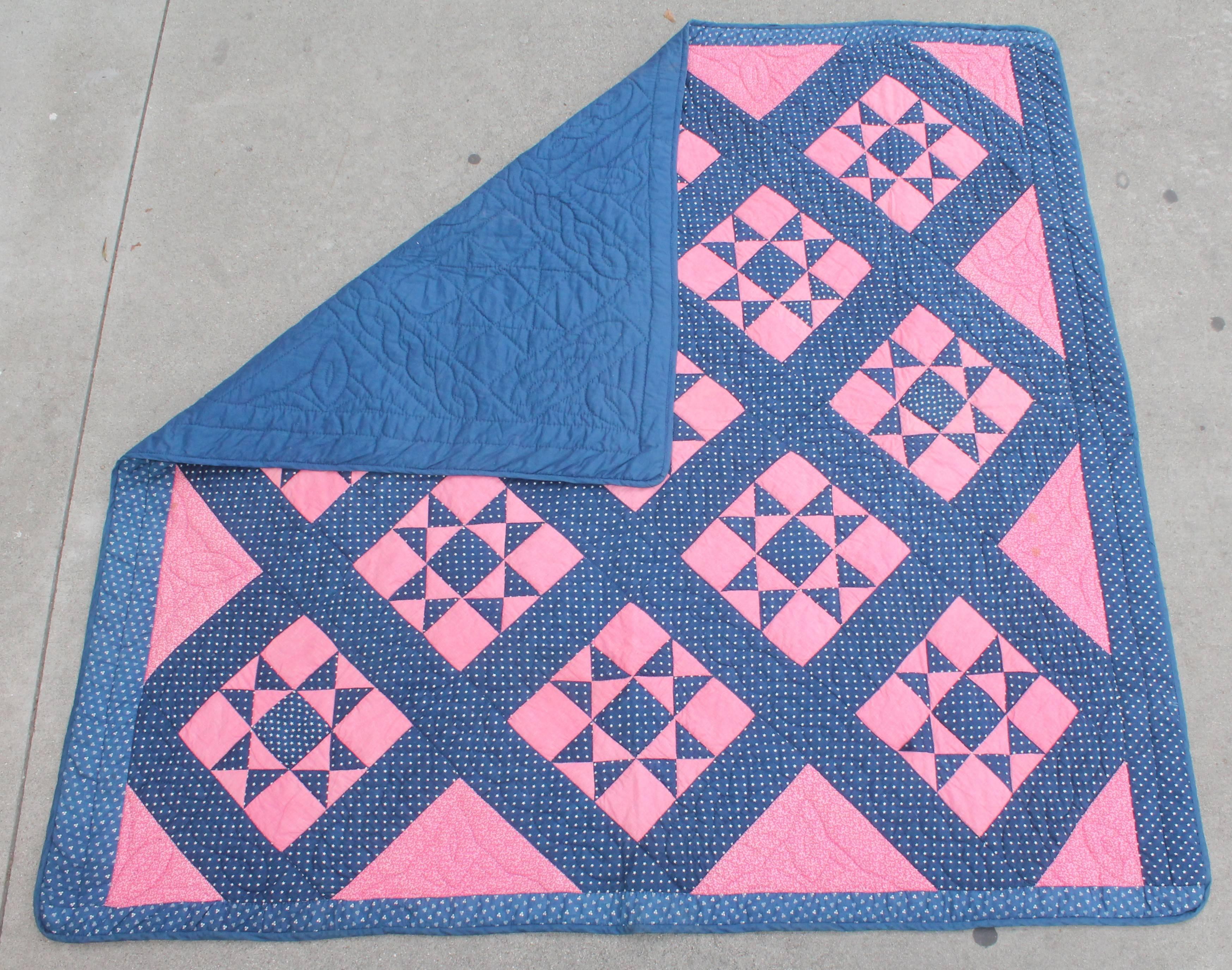 19th century blue calico and pink calico eight point star. Very nice tight quilting and piecing.