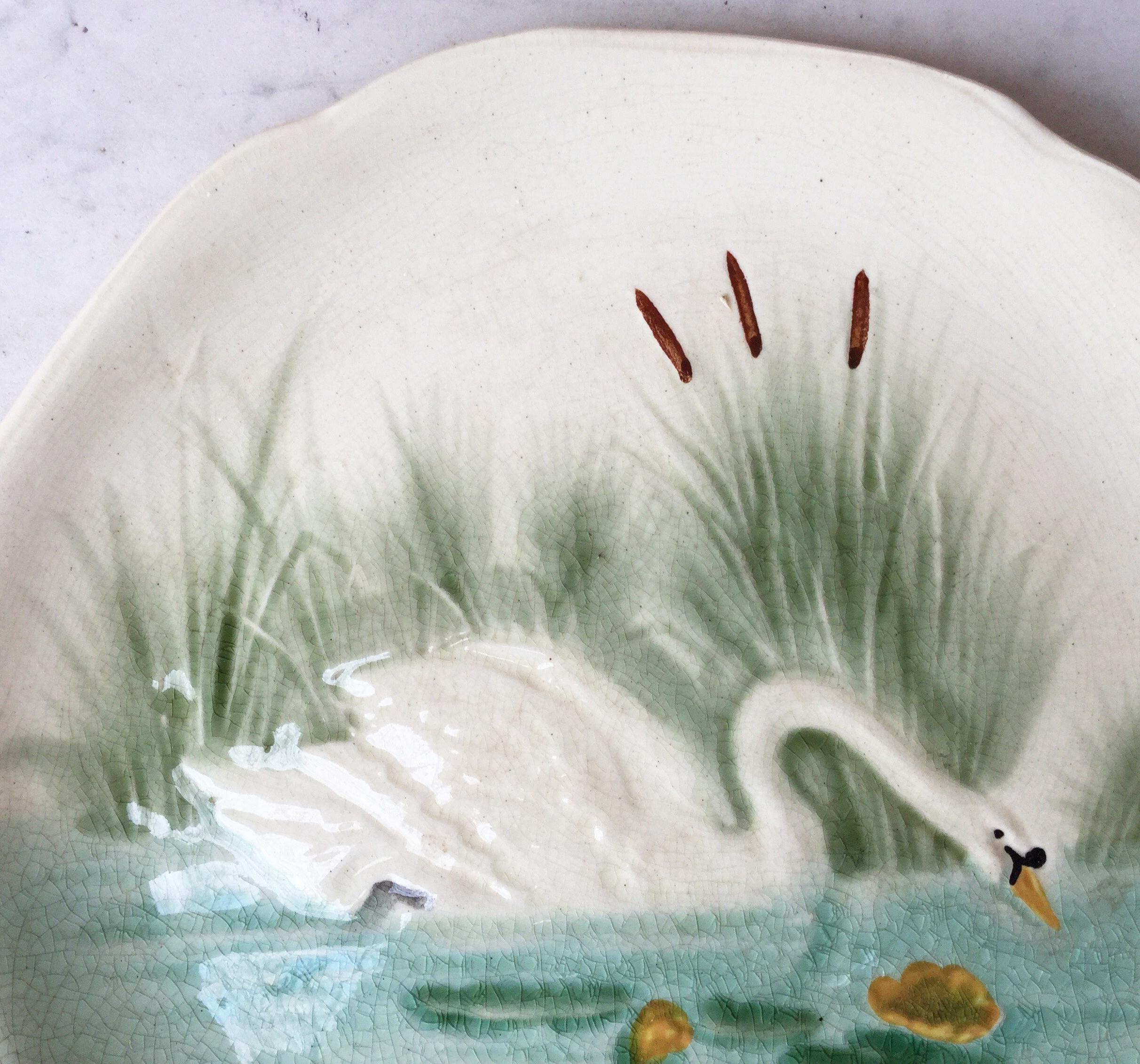 Majolica plate with a swan on a pond signed Hippolyte Boulenger Choisy le Roi, circa 1890.
The manufacture of Choisy le Roi was one of the most important manufacture at the end of 19th century, they produced very high quality ceramics of all kinds