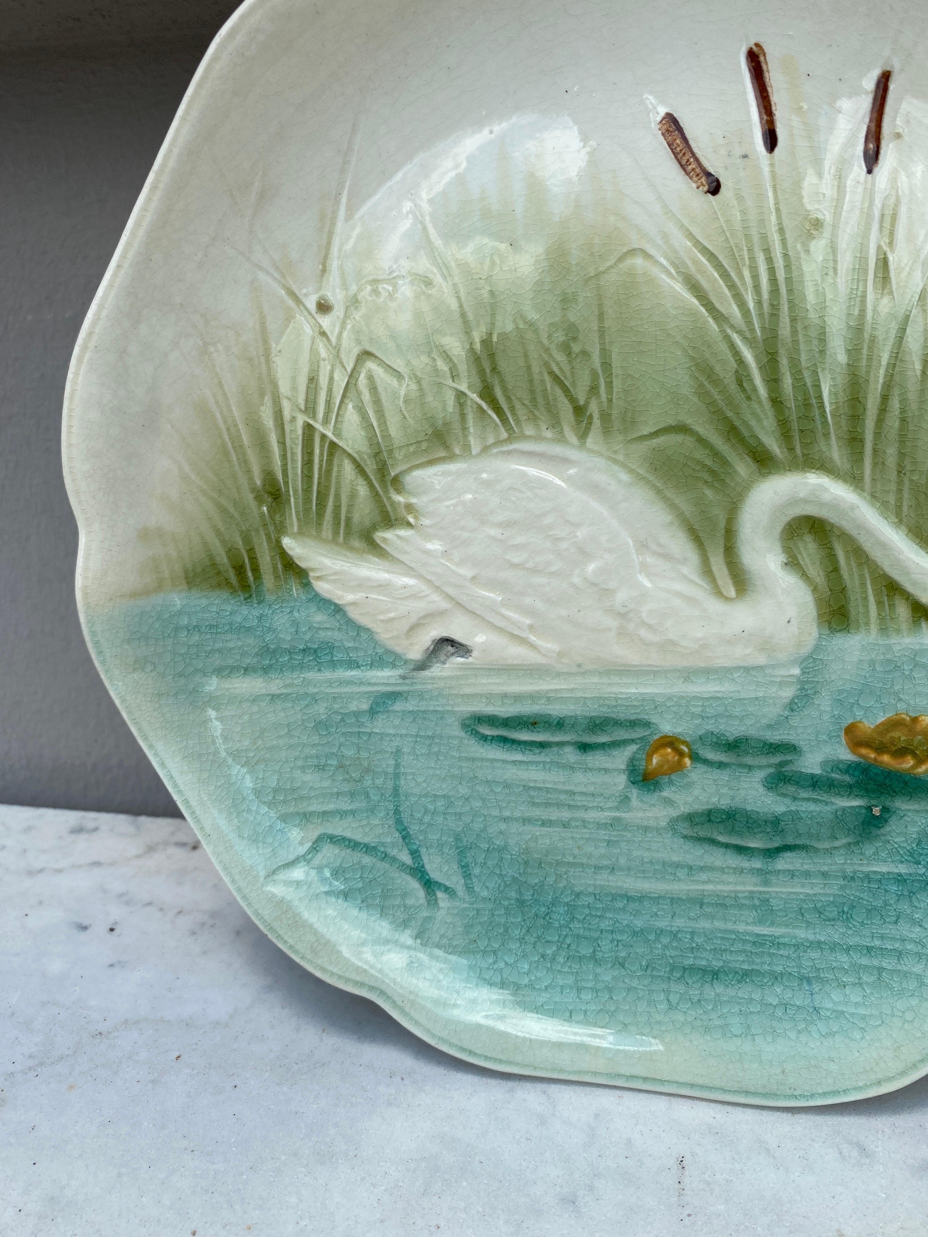 Majolica plate with a swan on a pond signed Hippolyte Boulenger Choisy le Roi, circa 1890.
The manufacture of Choisy le Roi was one of the most important manufacture at the end of 19th century, they produced very high quality ceramics of all kinds