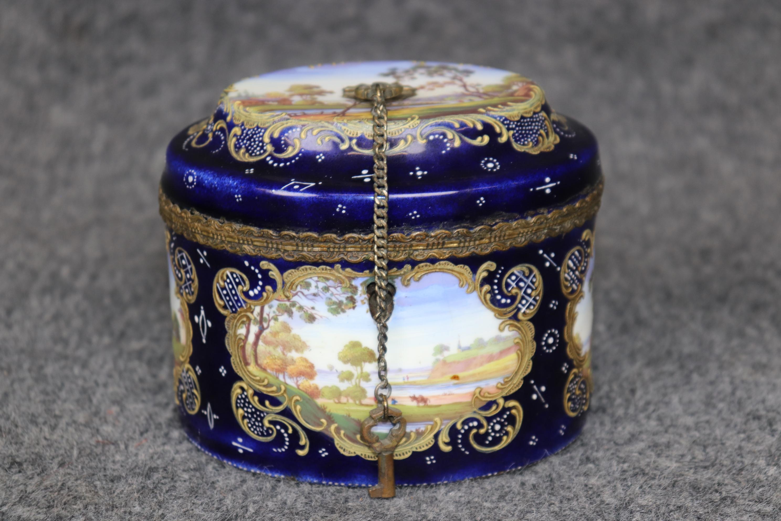 Dimensions: Height: 4 1/4in Width: 4 3/4in Depth: 3 3/4in 

This antique 19th century Royal Vienna jewelry casket is made of the highest quality! Made in the 1890's, this petite jewelry box perfect for storing away any precious jewelry or small