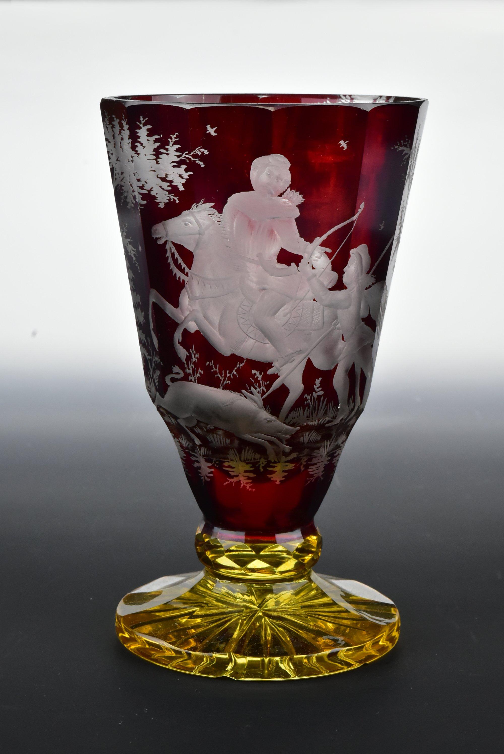 Description: Two colored Bohemian art glass spill vase with a hand engraved hunting scene.

Age: circa 1850 - 1875.

Size: Approximately 6 inches tall by 3 + 1/2 inches across the mouth by 3 + 1/8 inches across the foot rim.

Condition: Age