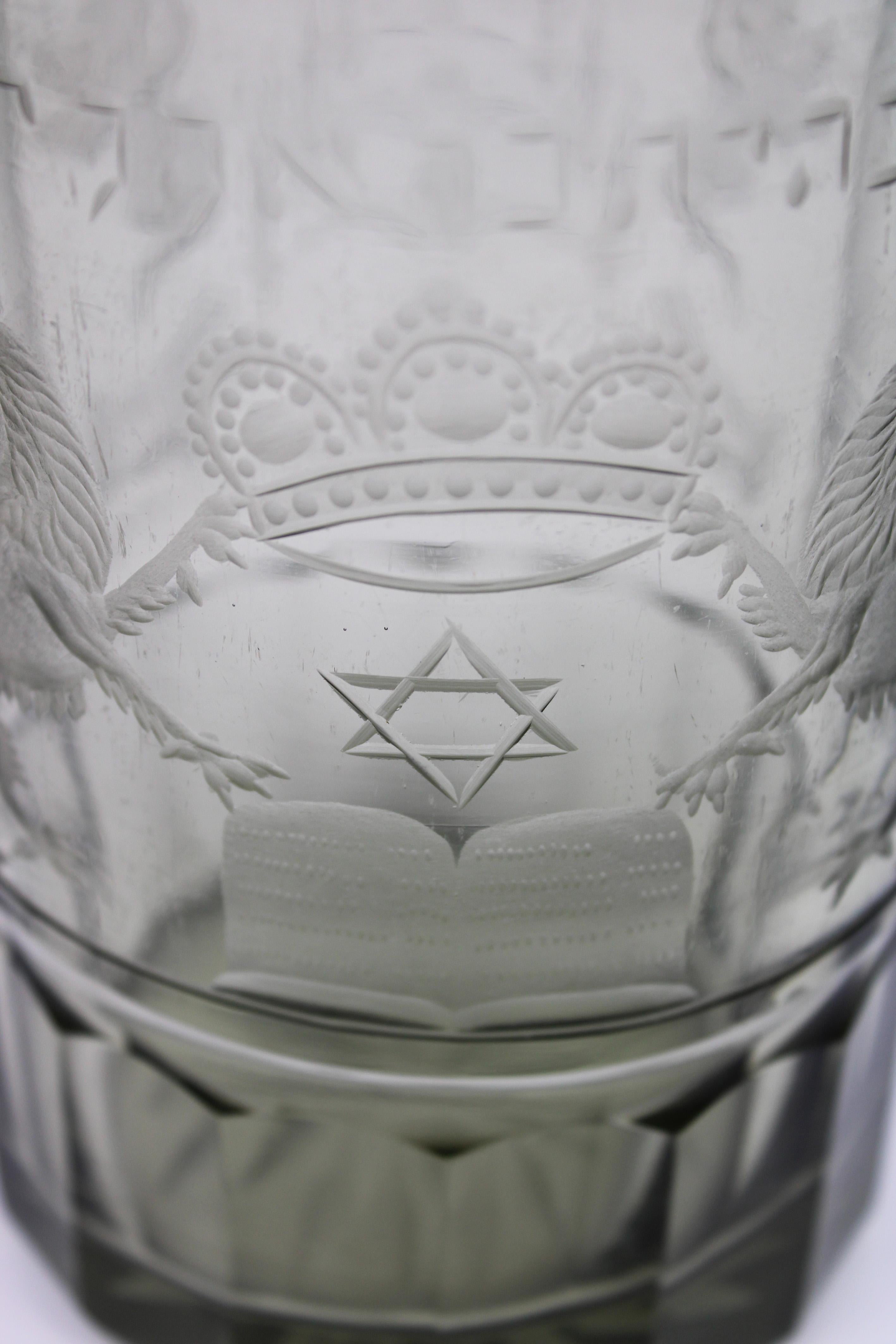 Presenting a remarkable 19th-century Bohemian glass Jewish Chevra Kadisha candle holder from the Czech Republic. This exquisite piece is intricately decorated with classic Jewish iconographic elements, showcasing the exceptional craftsmanship and