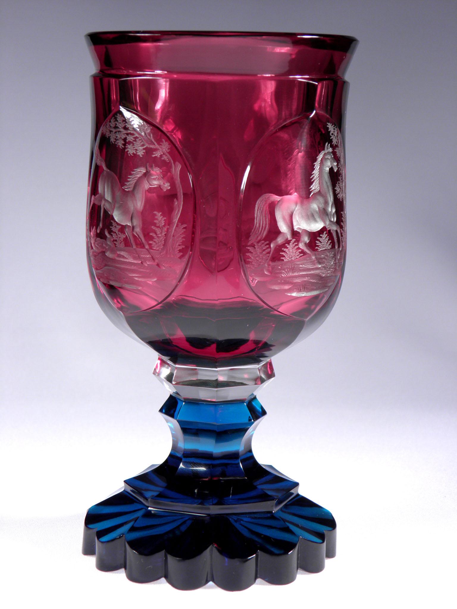 Antique Bohemian ruby goblet with aquamarine leg. Hand engraved medallion with horse motive.