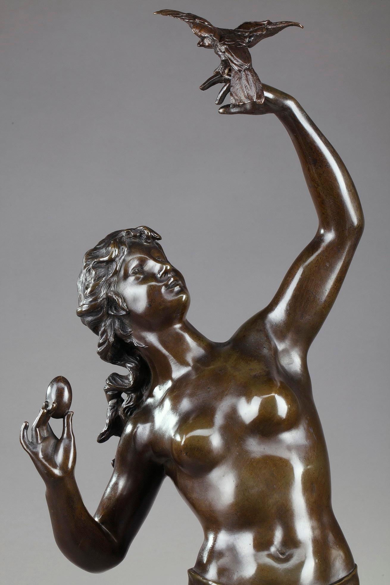 Large bronze figure with brown patina featuring a young woman holding a parrot on her arm. In the other hand she is holding an egg. The parrot trainer rests on a small base signed: Drouot. Antique cast, late 19th century period,

circa
