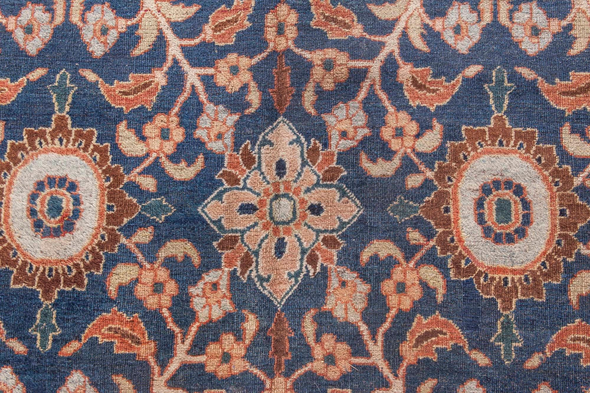 19th century botanic Persian Meshad caramel and navy blue handwoven wool rug
Size: 6'2