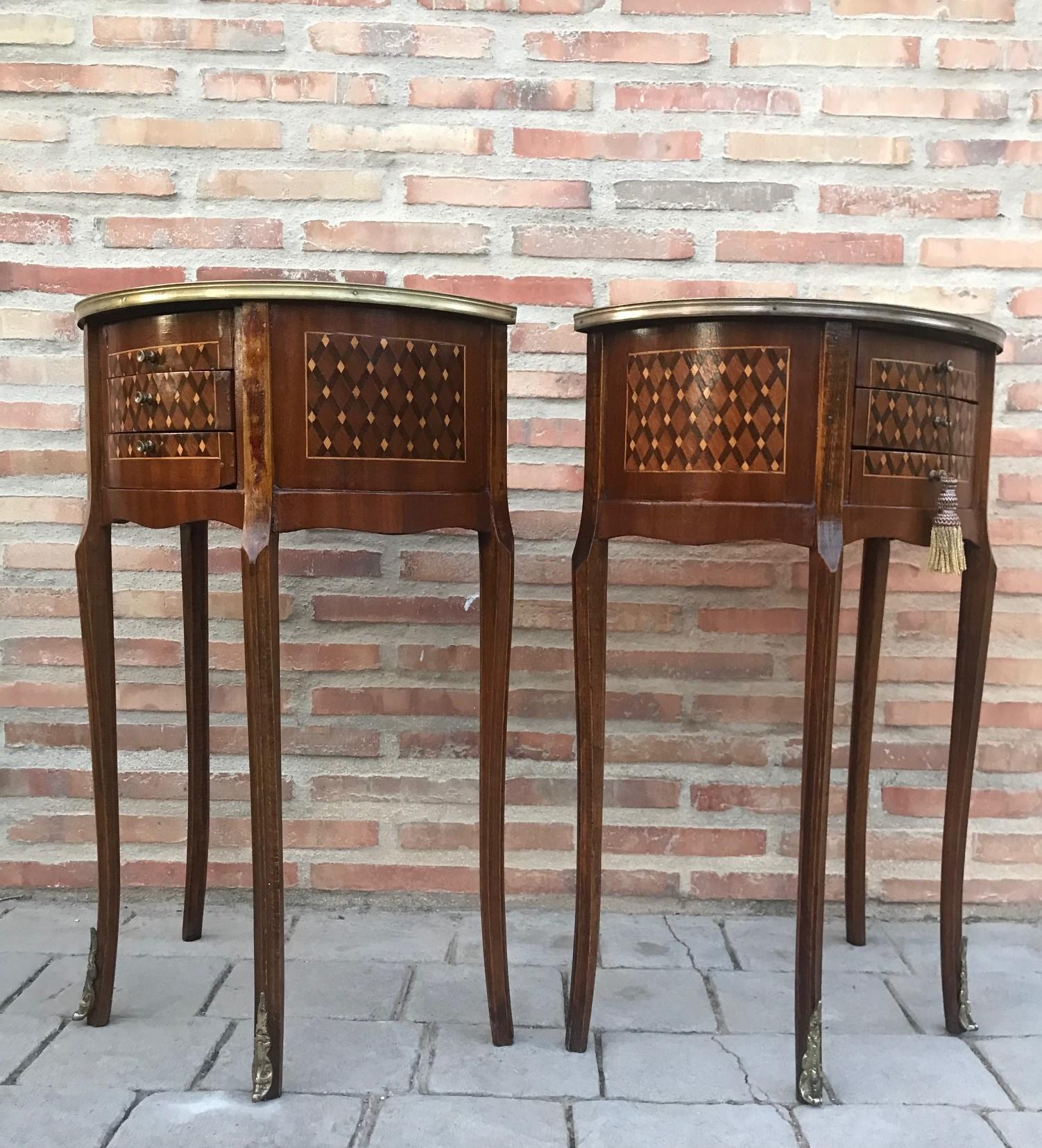 French Louis XVI style side table or nightstand topped with marquetry top, fluted legs finished with golden bronze clogs. Three dovetailed small drawers with brass details.

     