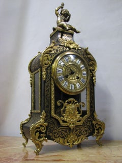 19th Century Boulle Mantel Clock Richly Ornamented