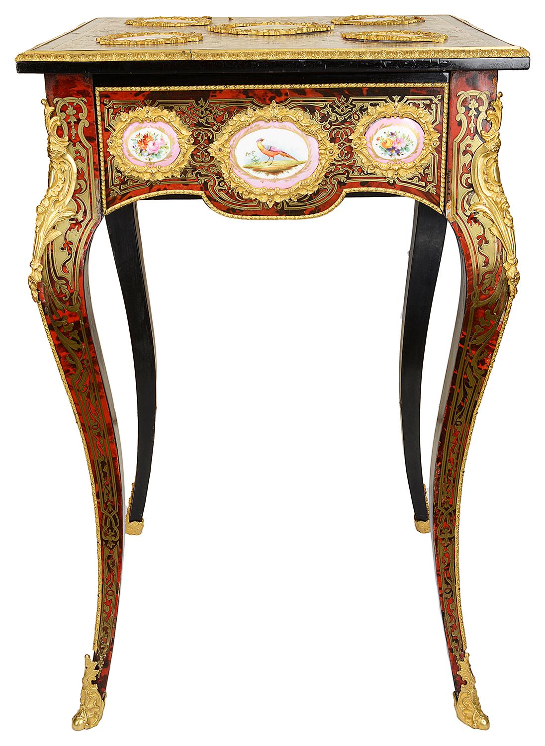 A very good quality 19th century French Boulle inlaid side table, having gilded ormolu mounts, Sevres style porcelain plaques with classical romantic scenes, flowers and birds. The fine scrolling brass inlay to the top and side, a single frieze