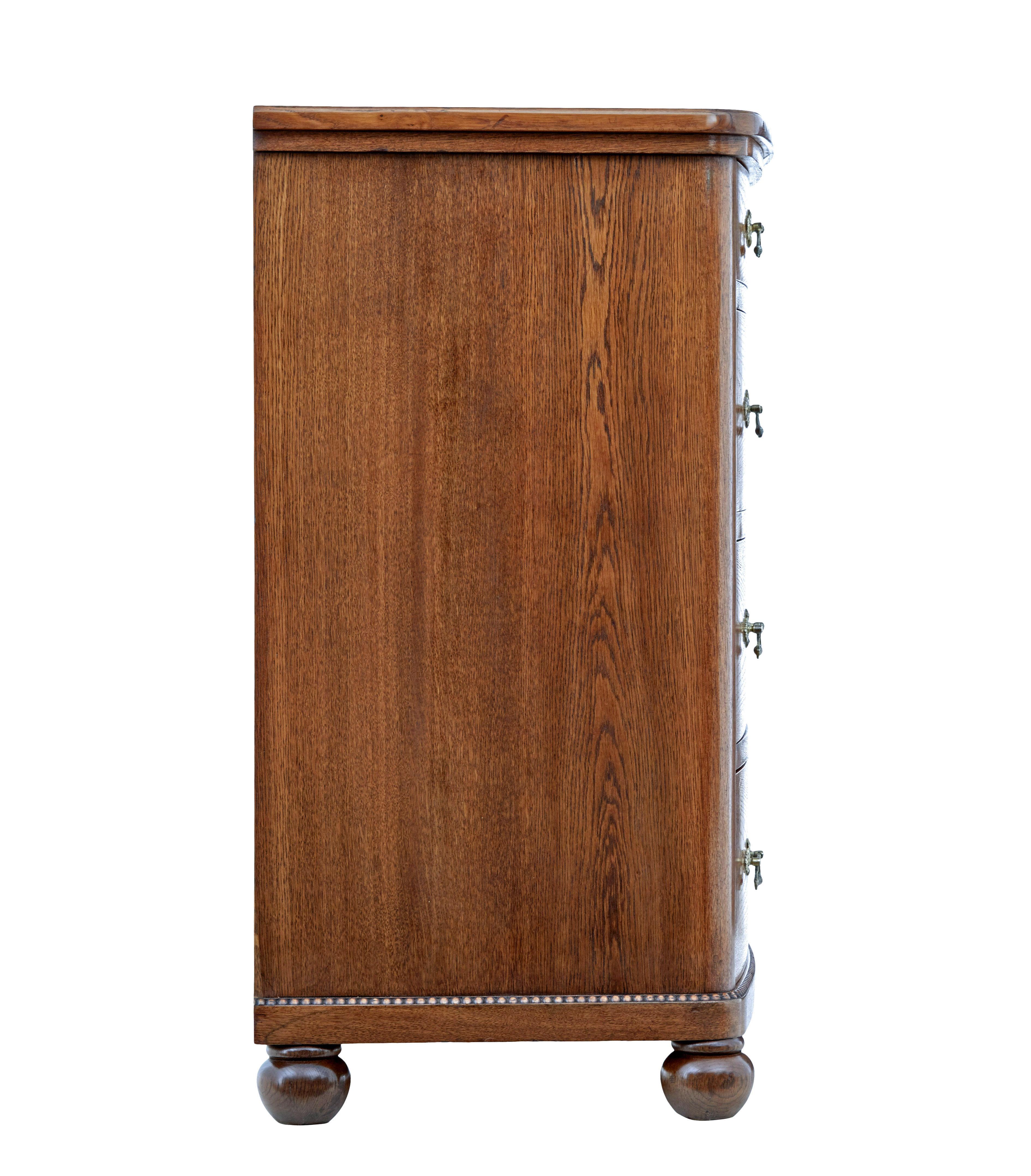 Hand-Carved 19th century bow front oak chest of drawers For Sale