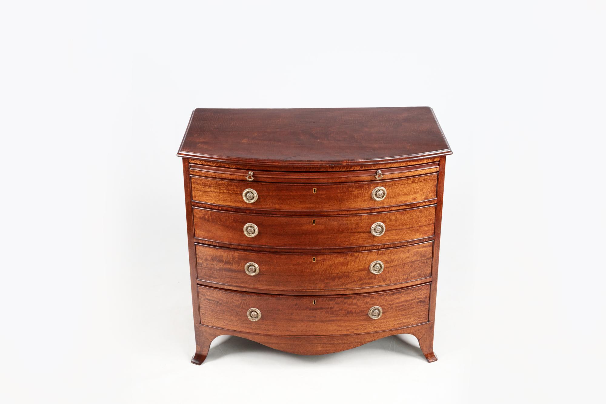 Irish 19th Century Bow Fronted Mahogany Chest with Pull-Out Dressing Slide For Sale