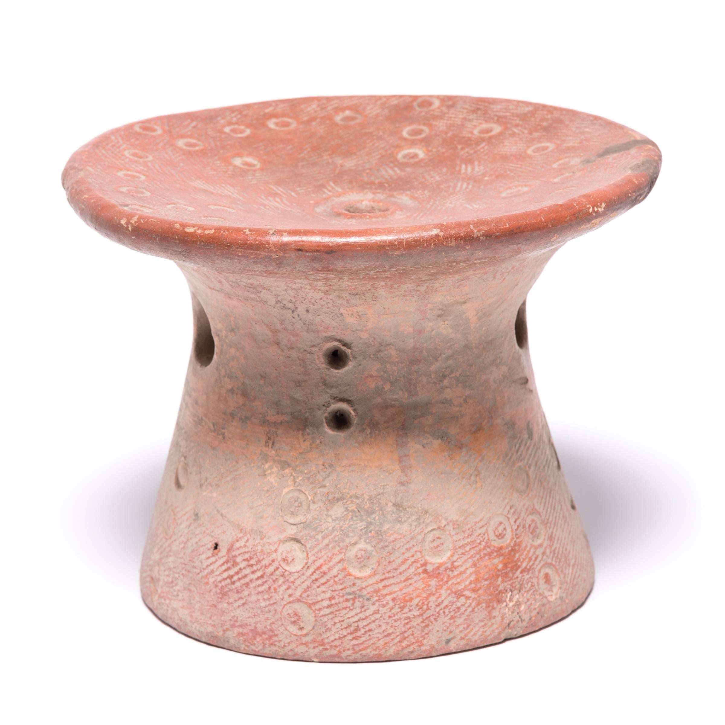 Called a tigué in the Bozo language, this ceramic stool was given as a gift to a new bride among the Niger River-dwelling people of Mali. Seated on the stool upon arrival to her husband's home, the bride took pride in her gift, as well as comfort in
