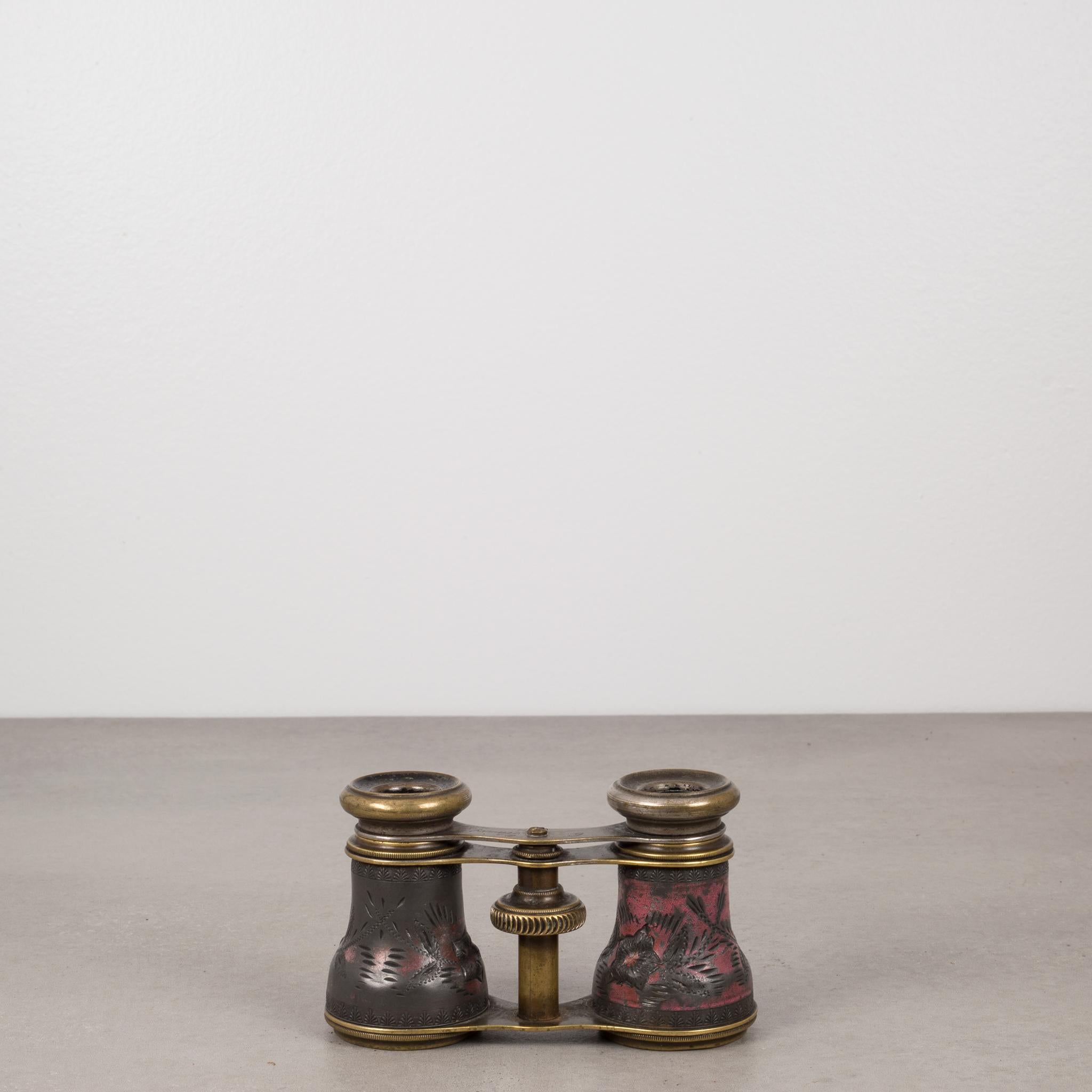 Lovely pair of brass binoculars with embossed metal. Made in France, circa 1880s. The metal is embossed with flowers and leaves and has some original red paint.
The top centre has 