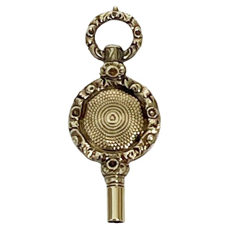 Chiave per orologio in ottone e oro del XIX secolo in vendita
