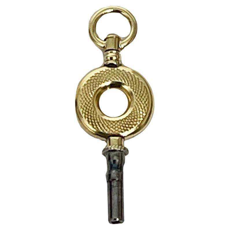 Chiave per orologio in ottone e oro del XIX secolo