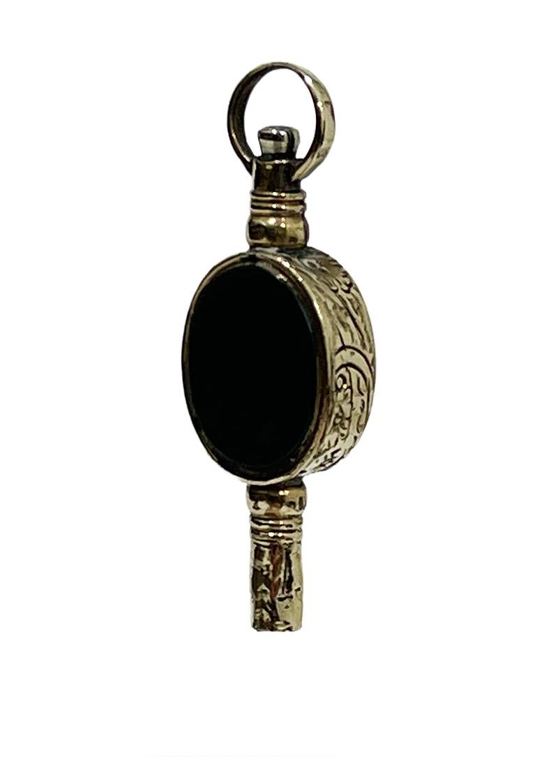 19th century brass and gold Watch-Key with each side a different stone

A brass watch key , gold-plated with 2 different colors. An amber color transparent and is smooth on the outside and facet cut inside. This gives more dimension. On the other