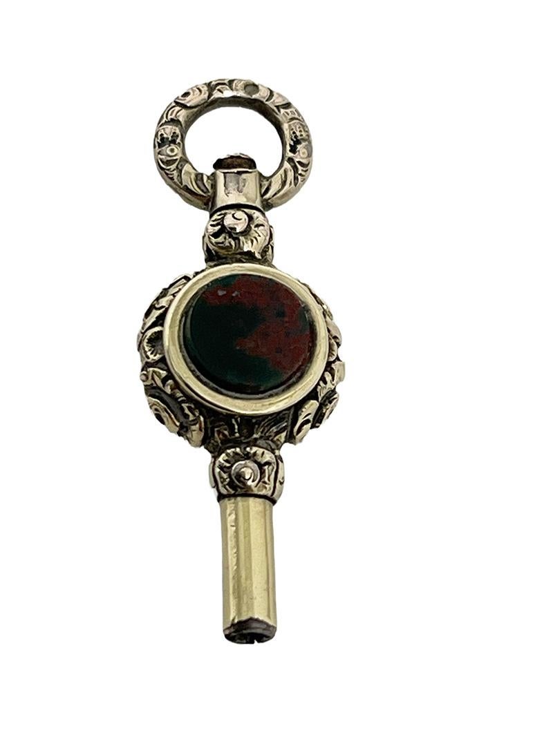 19th century Brass and Gold Watch-Key with Agate and Heliotrope Stones

19th century brass and gold Watch-Key with each side a different stone
A brass watch key , gold-plated with Agate stone and a heliotrope. An orange Agate stone and the other
