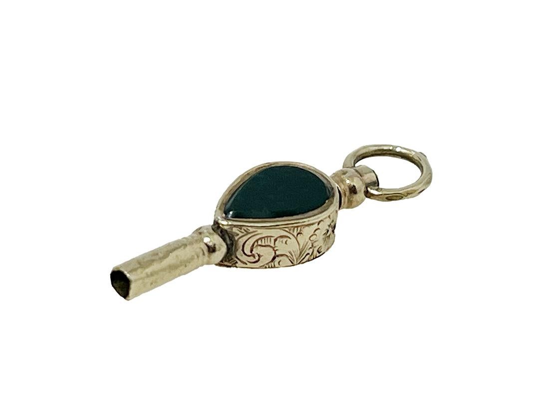 19th Century Brass and Gold Watch-Key with yellow clear and Heliotrope Stones

19th century very small brass and gold Watch-Key with each side a different stone
A brass watch key , gold-plated with yellow clear stone and a heliotrope in pear shape.