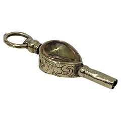 Porte-montre du 19e siècle en laiton et or, jaune clair et pierres d'hélice