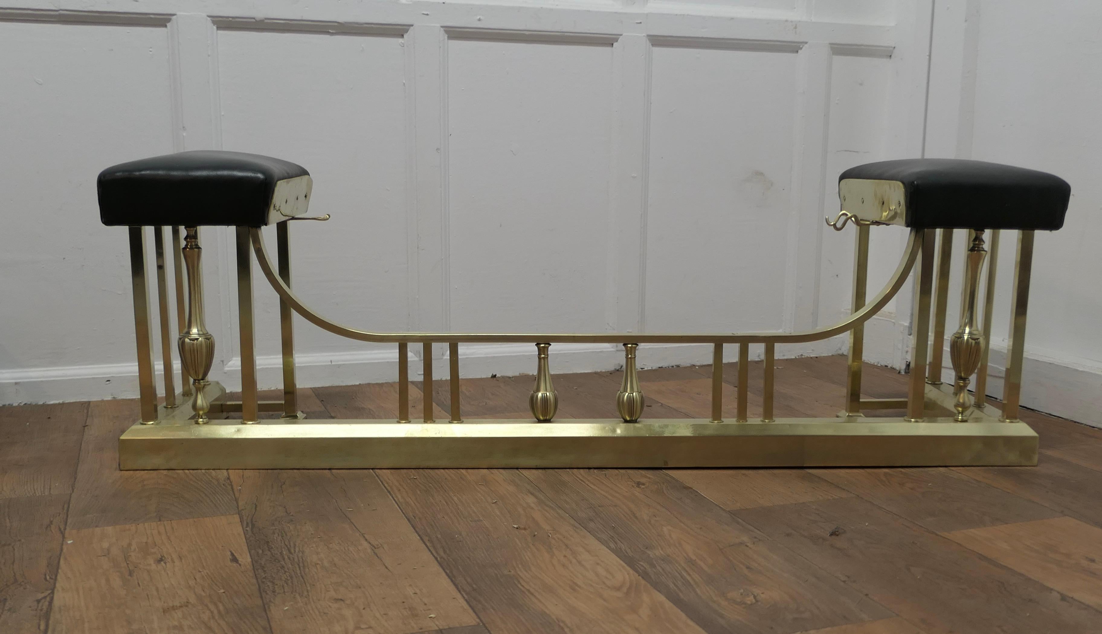 19th Century Brass and Leather Club Fender

This is an elegant piece of country House Furniture, the Leather seats are upholstered in black and there are fire tool supports on each
The fender is in good condition all round
The fender is 17” high,