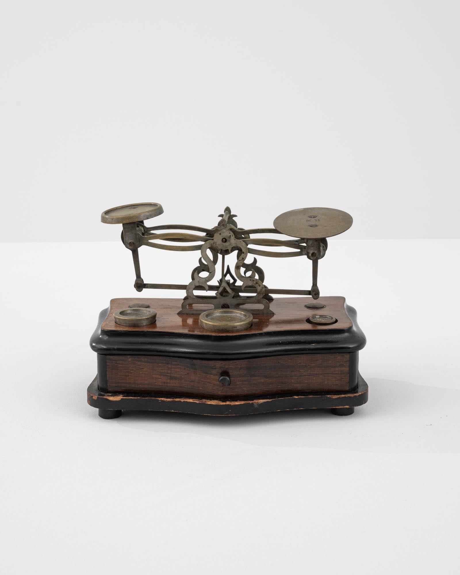 Loyally underhand for quickly weighing out gemstones and precious medals, this trustworthy sidekick was once the prized tool for the detailed work of the jeweler. Made in France in the 19th Century, its careful construction expresses the fascination