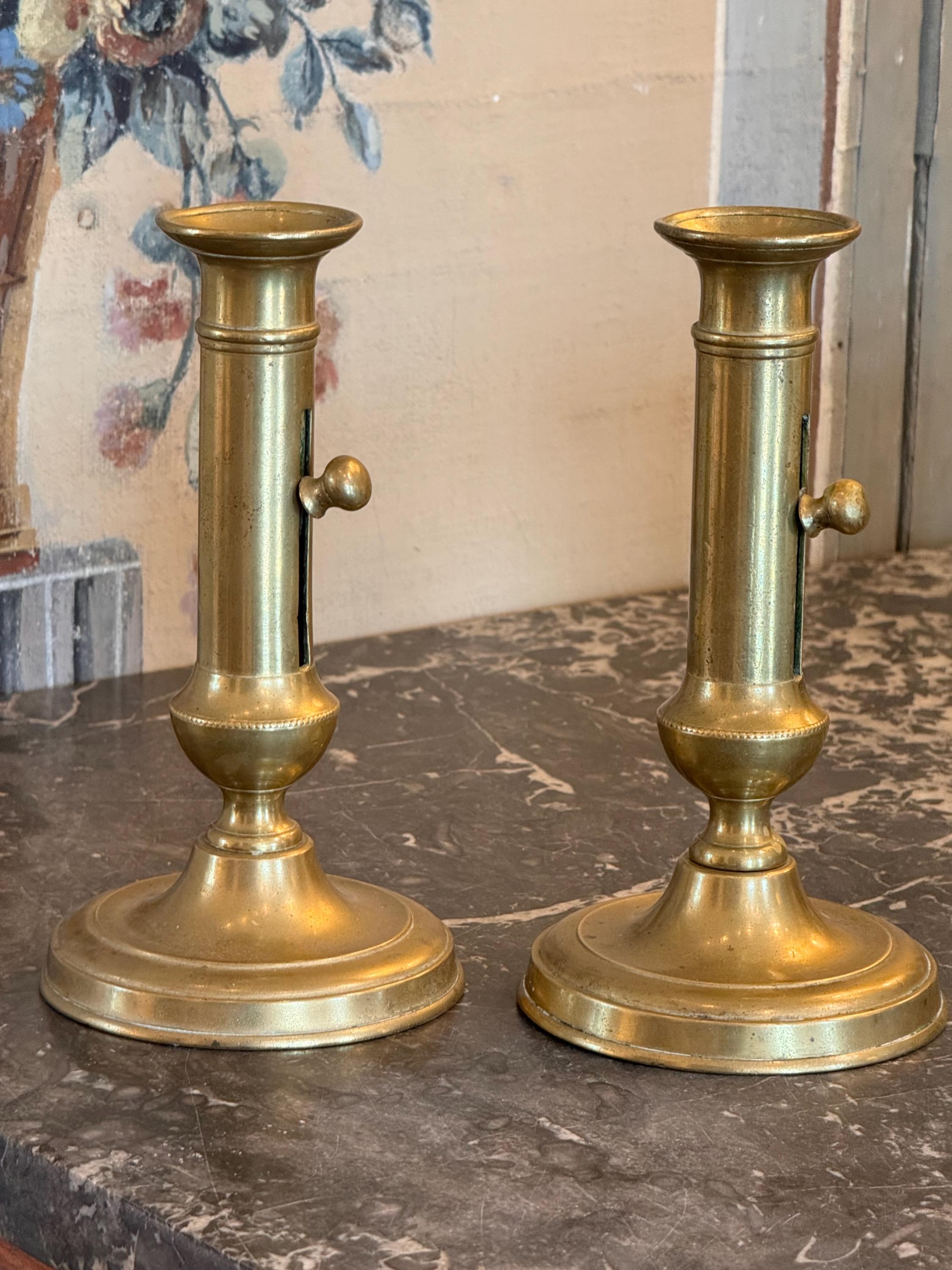 These are called push up candle sticks. They are brass and very pretty.