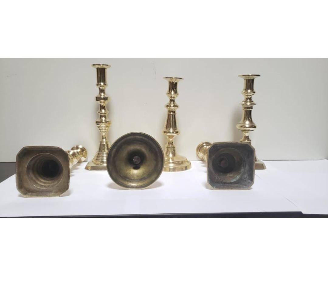 This selection of baluster-stemmed Victorian brass candlesticks are all about 10