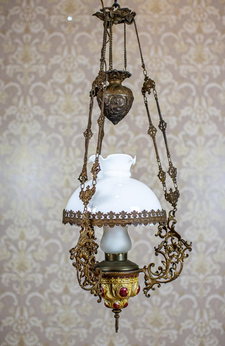 19th Century Brass-Ceramic Kerosene Lamp Turned Into Electric Ceiling Lamp

We present you this big ceiling lamp from the late 19th century.
Originally, the lamp was kerosene and has been turned into an electric one later.
Its height can be