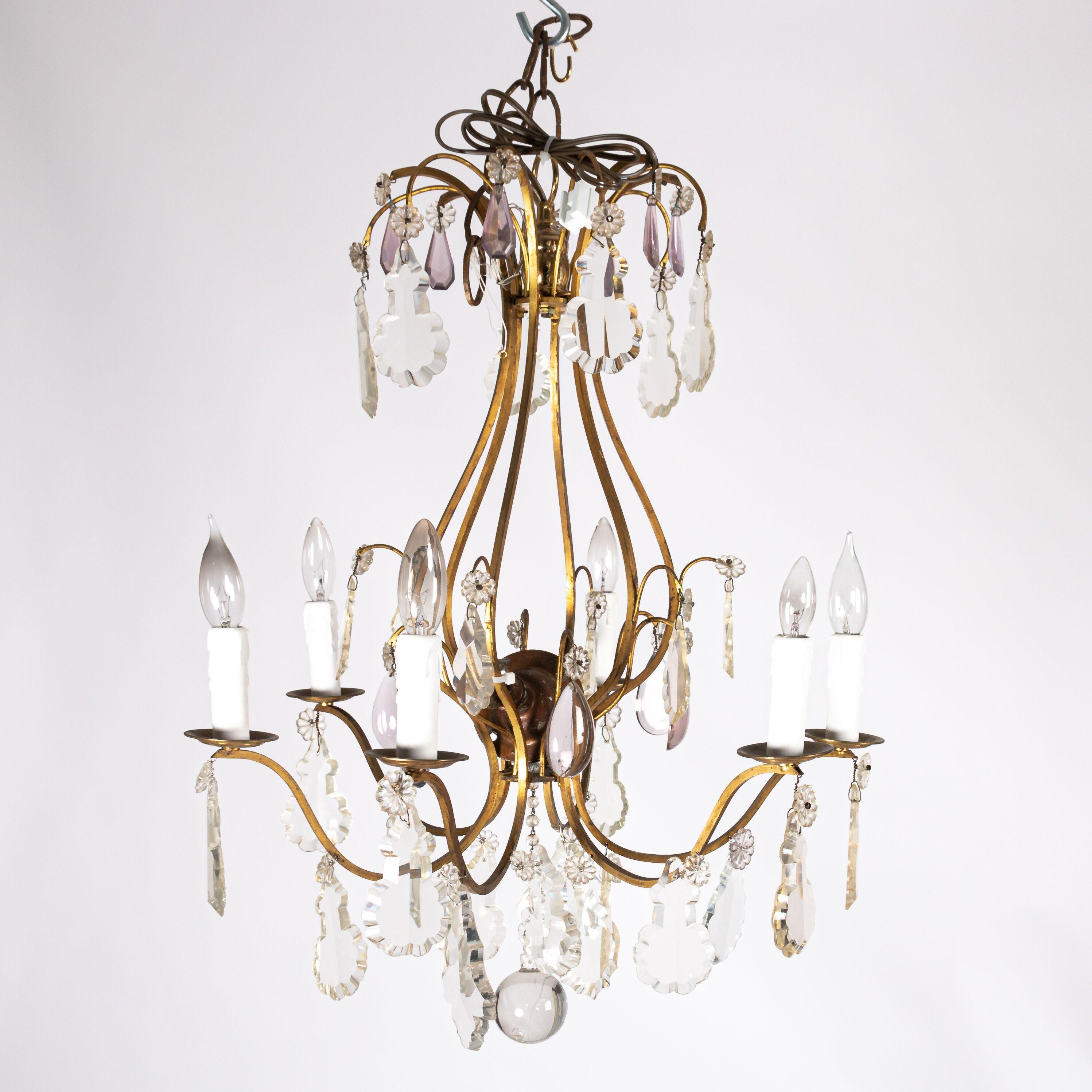 Exquisite antique six-light pendant chandelier made in France circa late 19th century. Minimal scrolled brass wire body is decorated with faceted crystal pendants. The glass ornaments are a variety of shapes, including lovely daisy flowers and