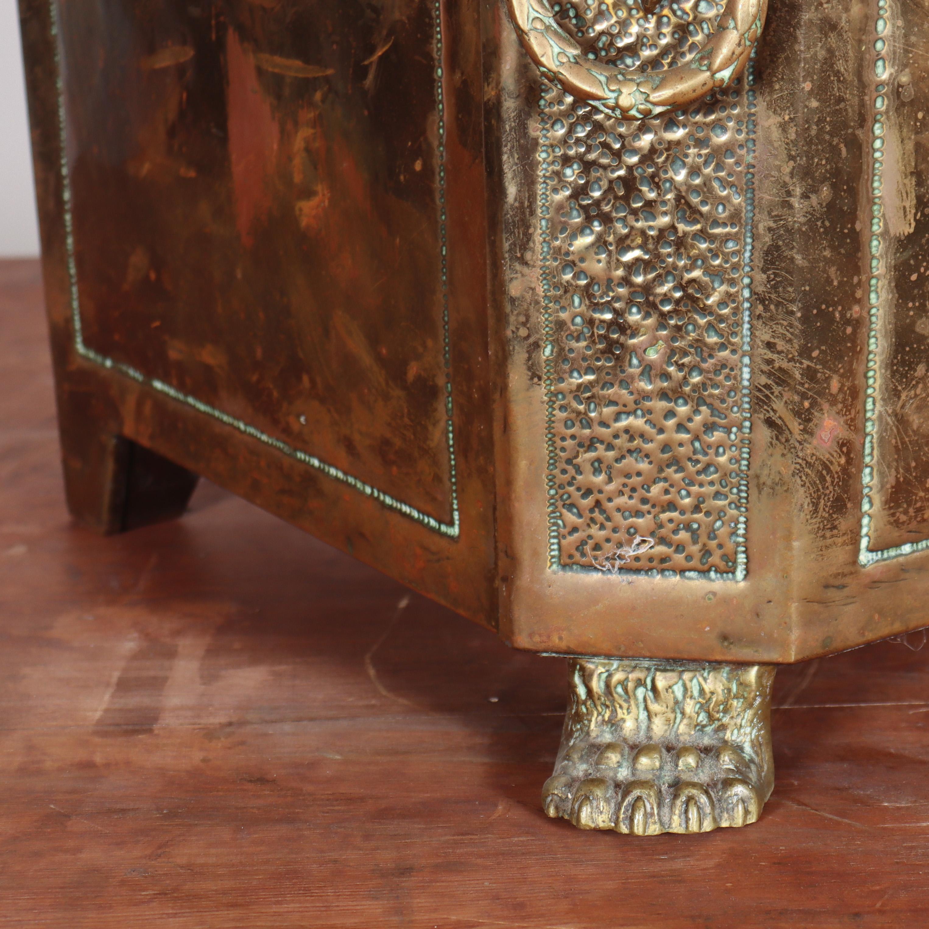 Late 19th C brass coal bin, decorated with lions heads and paw feet. 1890.

Reference: 7990

Dimensions
20 inches (51 cms) Wide
14.5 inches (37 cms) Deep
14 inches (36 cms) High