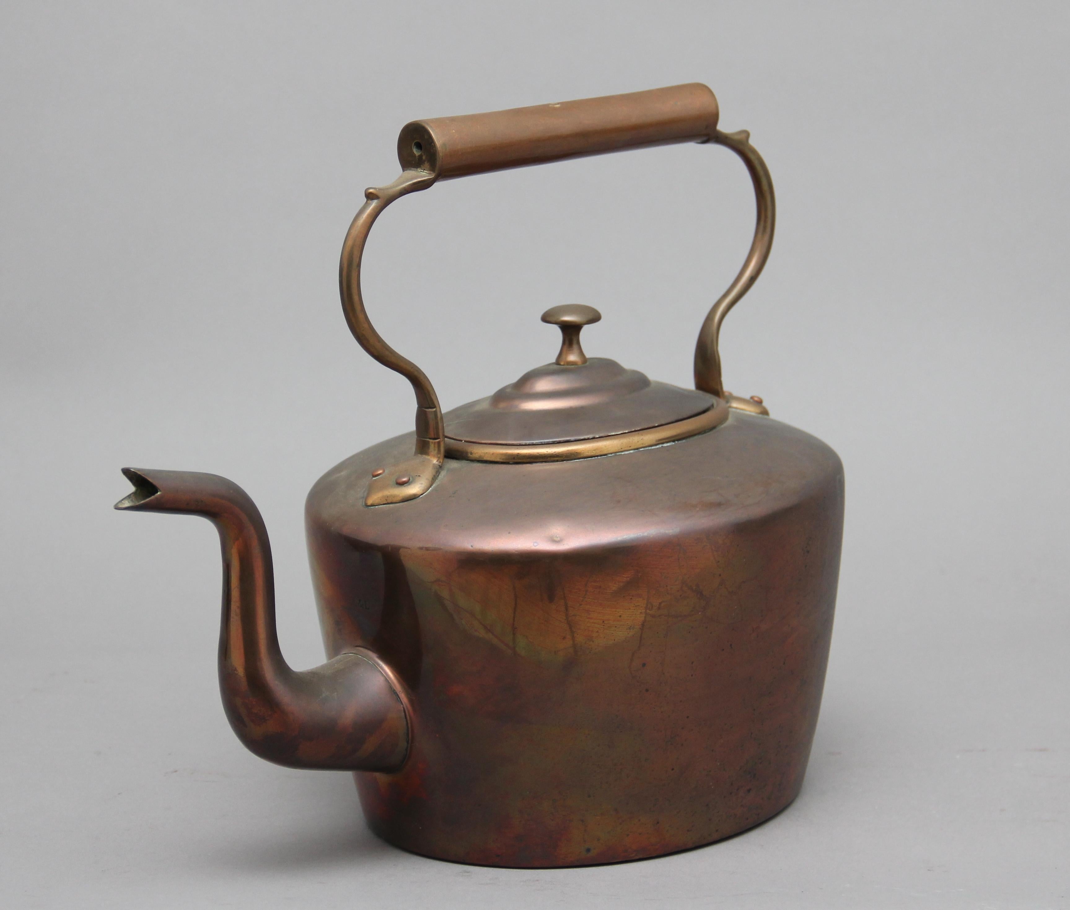 19th century brass copper kettle, having a shaped handle, acorn finial on the lid and a shaped spout, circa 1860.