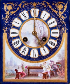An English Porcelain Clock and Ormolu Garniture