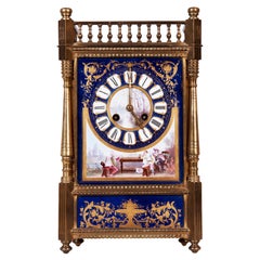 An English Porcelain Clock and Ormolu Garniture