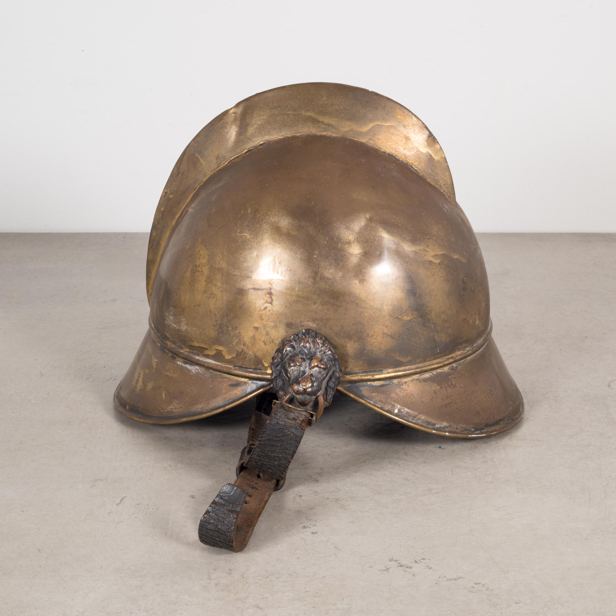 This solid brass fire helmet is handmade. The lining is made with leather.
The leather straps are intact and held onto the helmet by brass lions. 



   
