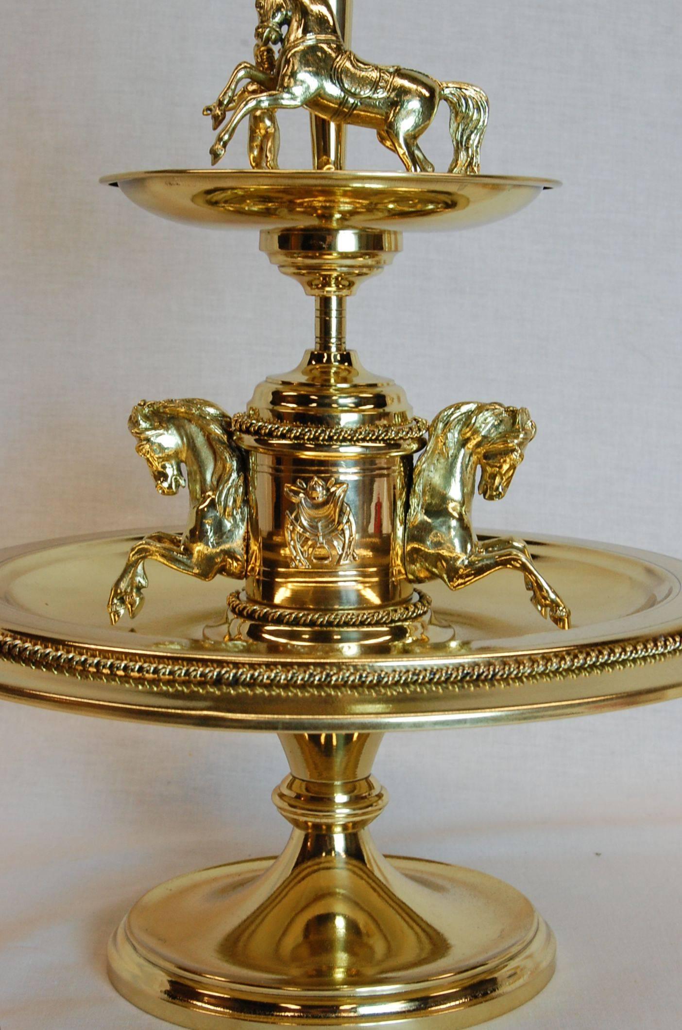 A well-made mid-late 19th century epergne with race horse figures and a glass epergne. Highly detailed jockey and horses with brass rope banding. Measure: The height without the glass is 14 3/4 inches. Just polished and lacquered.