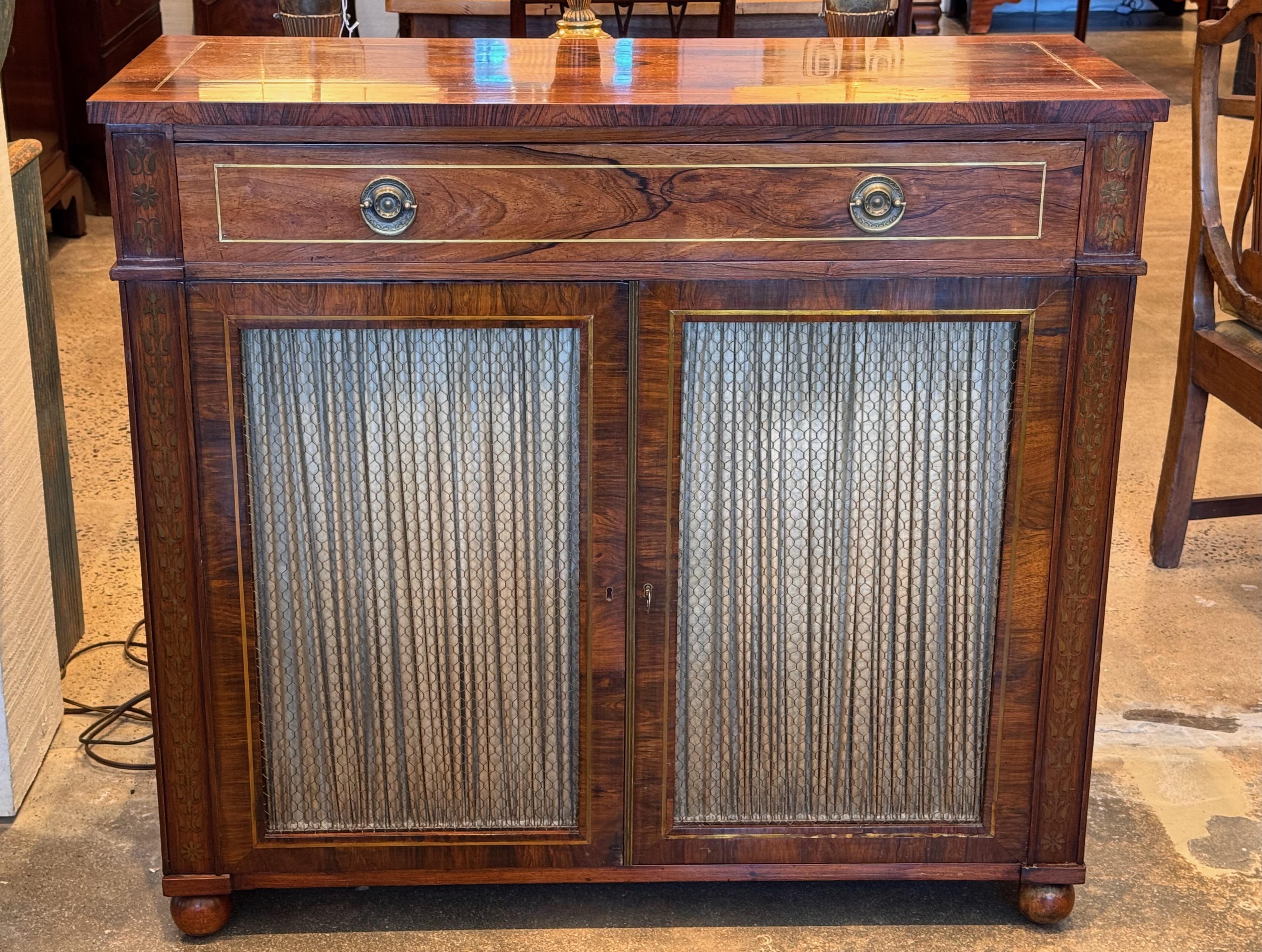 Rosewood is such a beautiful wood. This is enhanced with brass inlay.