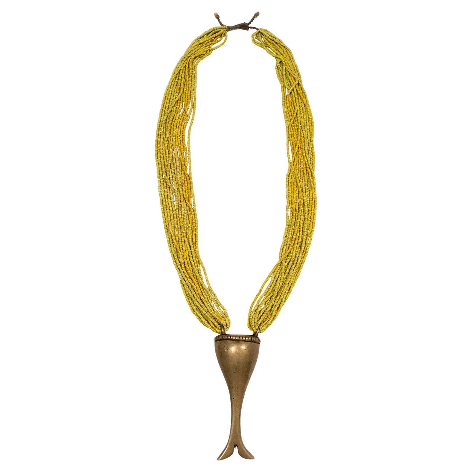 19th Century Brass Pendant on Yellow Multi-Strand Beaded Necklace, Naga, India For Sale