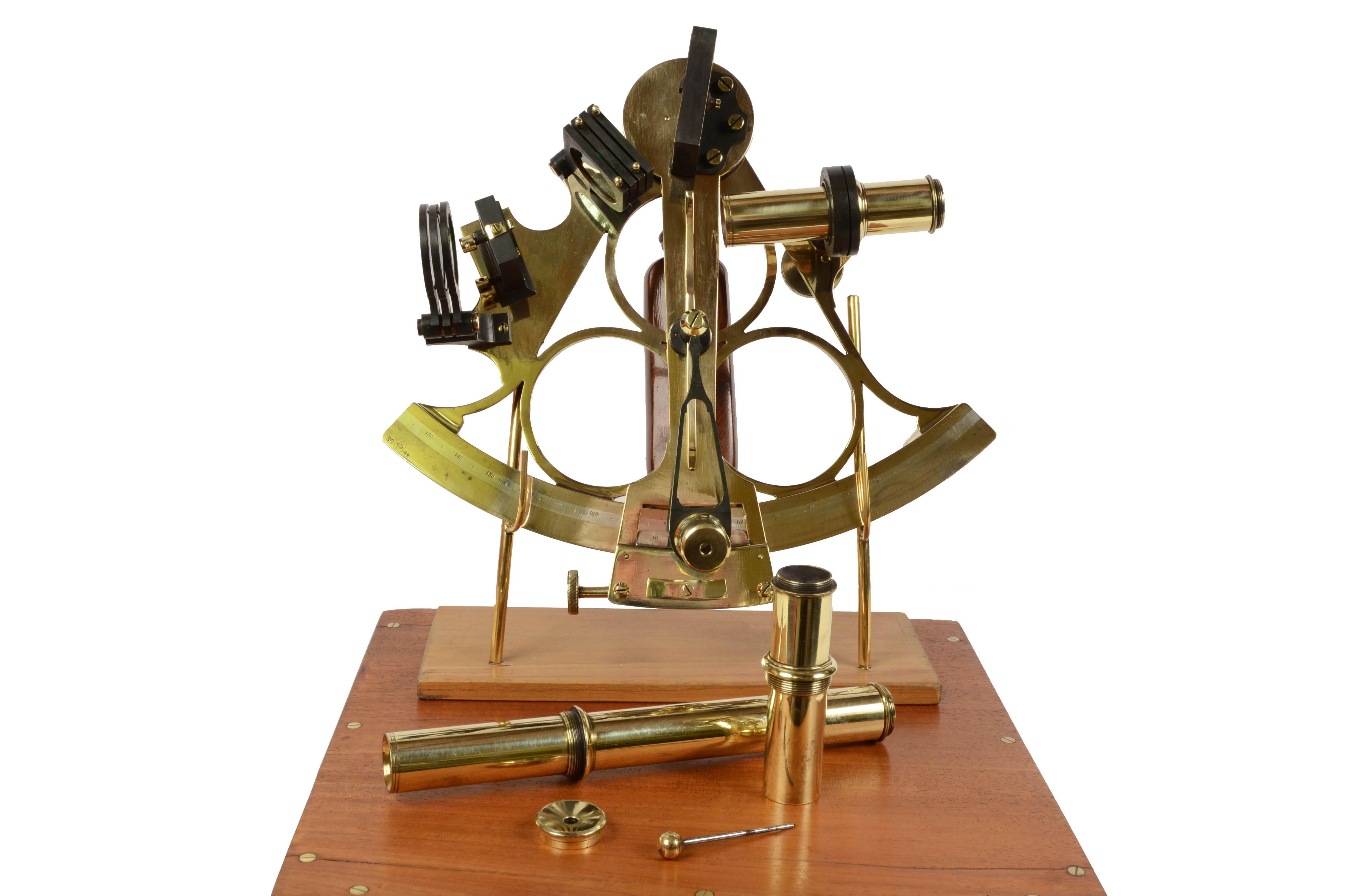 Mid 19th century brass English sextant signed Marshall London, instrument complete with three telescopes, one of which is long, and a filter and it is in its original mahogany box with brass hinges, latches and handle. Brass frame with engraved