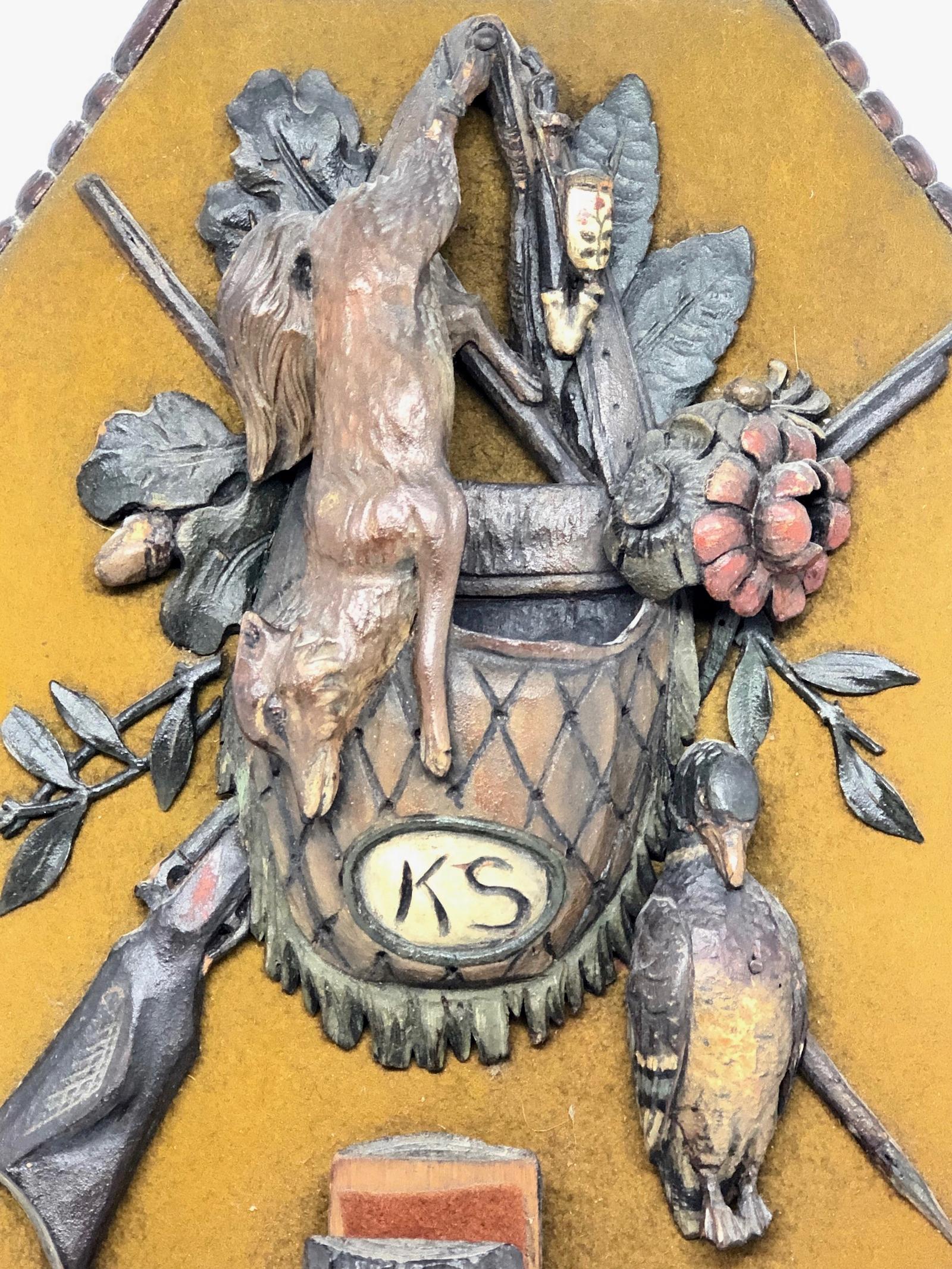 Here I have to offer a fine antique Victorian era classic 19th century Black Forest Brienz hand carved wall plaque with fruits of the Hunt motif with wild fox, duck, hunting rifle, pipe and powder Horn, spill or match holding hunting satchel with