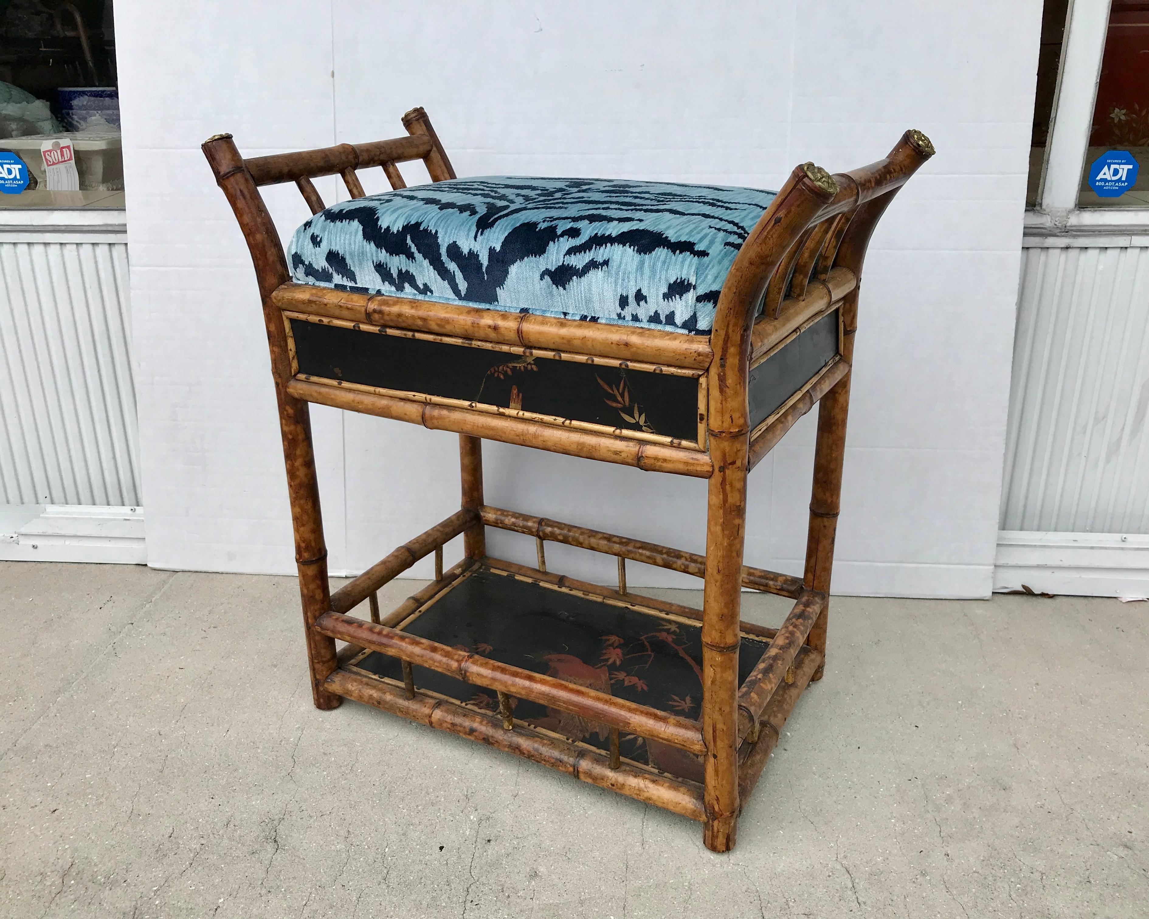 A superb Regency style bench with a chinoiserie lacquered base. 
The burnt bamboo bench is richly appointed with Luigi Bevilacqua
blue tiger cut velvet. This is an extremely rare form.