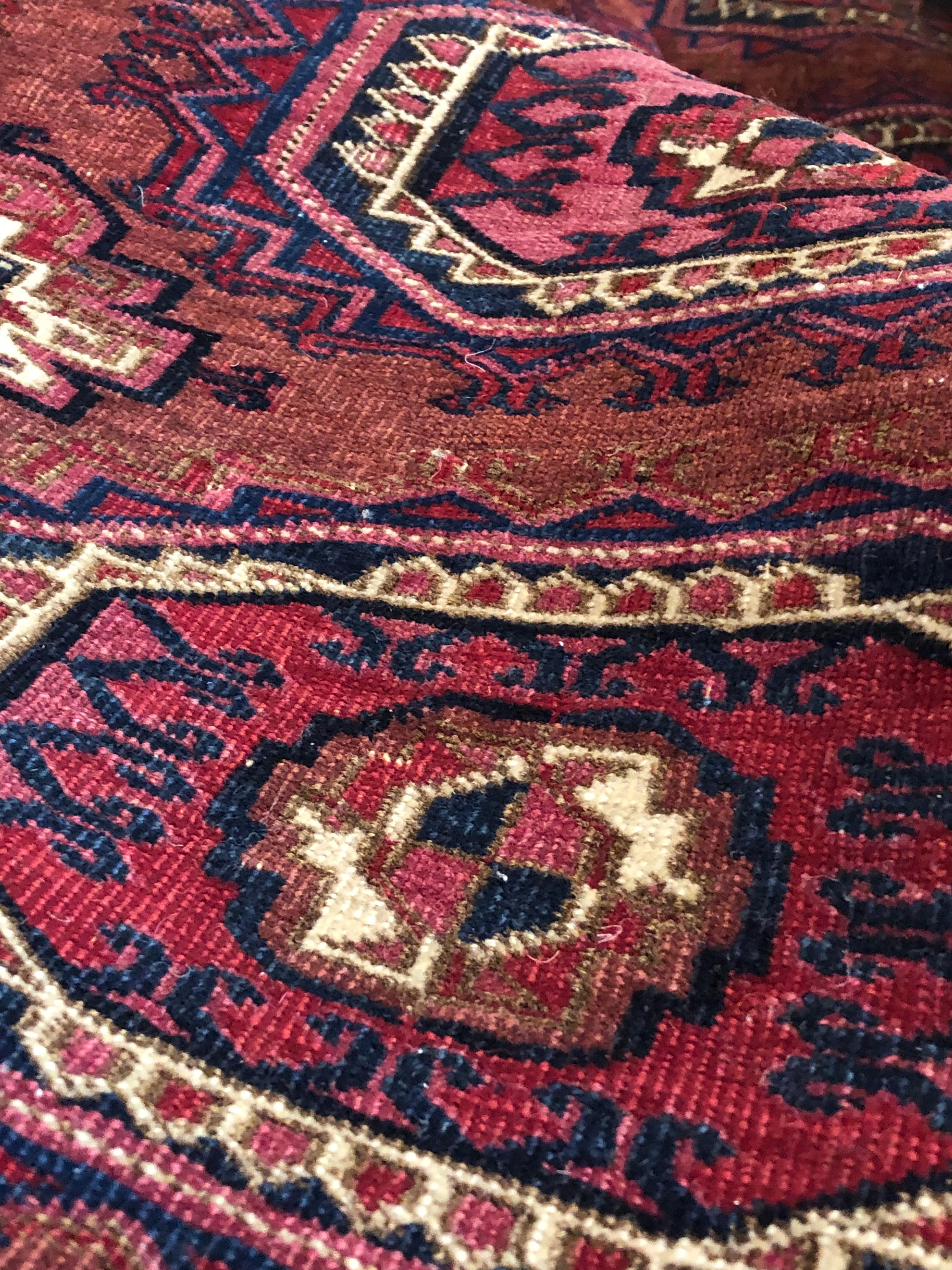 Wool 19th Century Brilliant Red Symmetrical Gul Turkmenistan Antique Rug, ca 1890